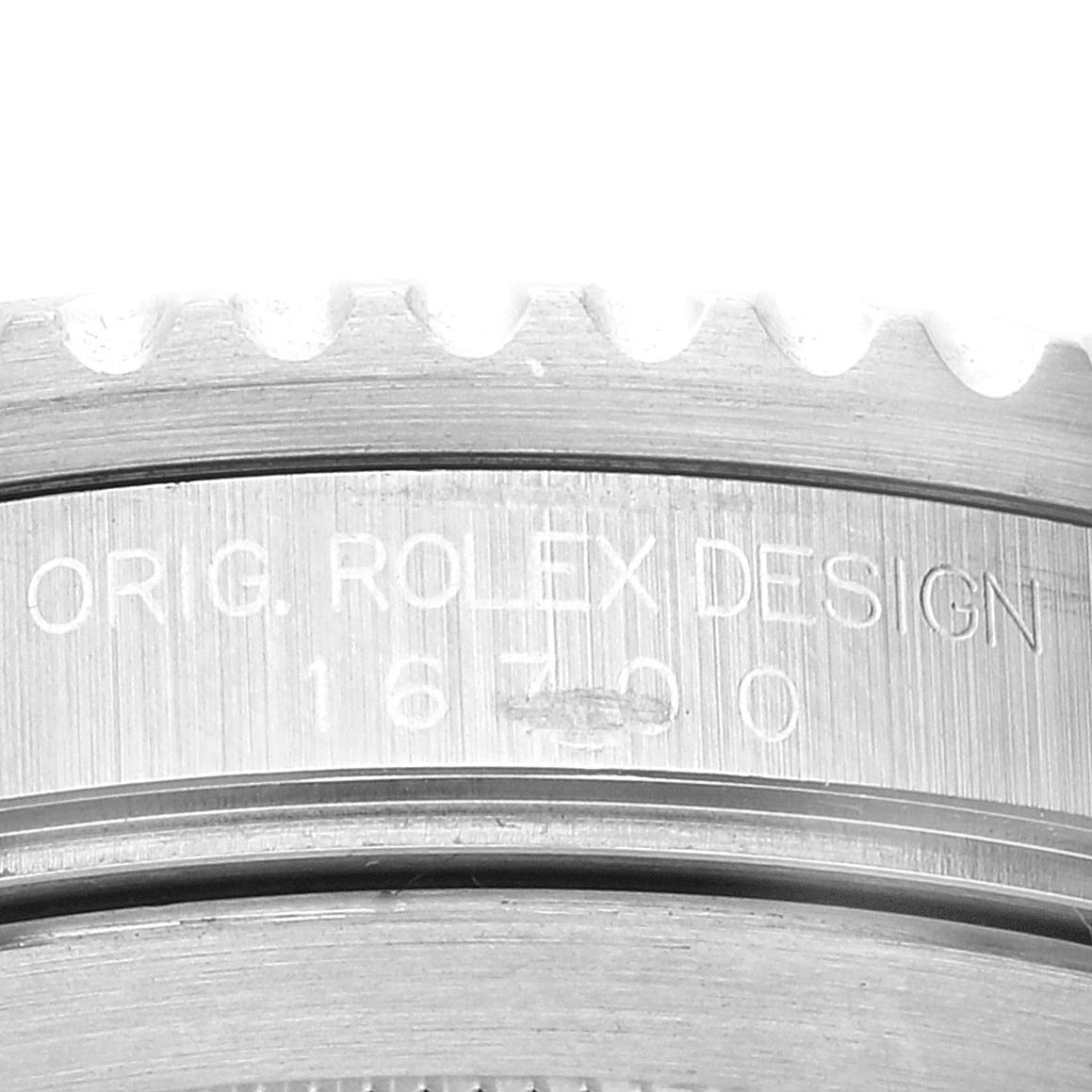 The image shows a close-up of the case side inscription with the model number of a Rolex GMT-Master 16700 Men
s Stainless Steel Black Dial 16700 Men
s Stainless Steel Black Dial watch.