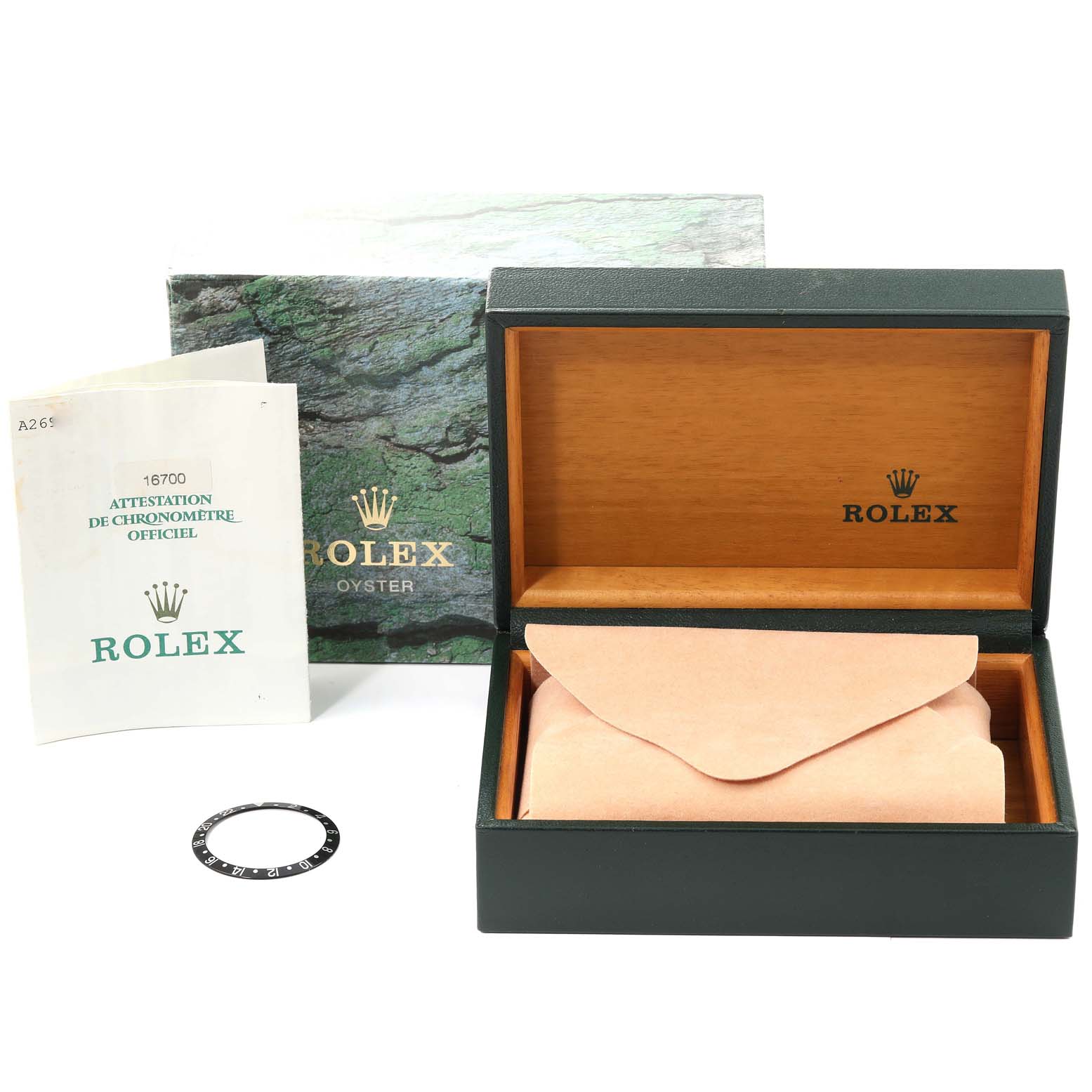 The image shows the packaging, documentation, and a bezel of a Rolex GMT-Master 16700 Men
s Stainless Steel Black Dial 16700 Men
s Stainless Steel Black Dial, including the box and manual.