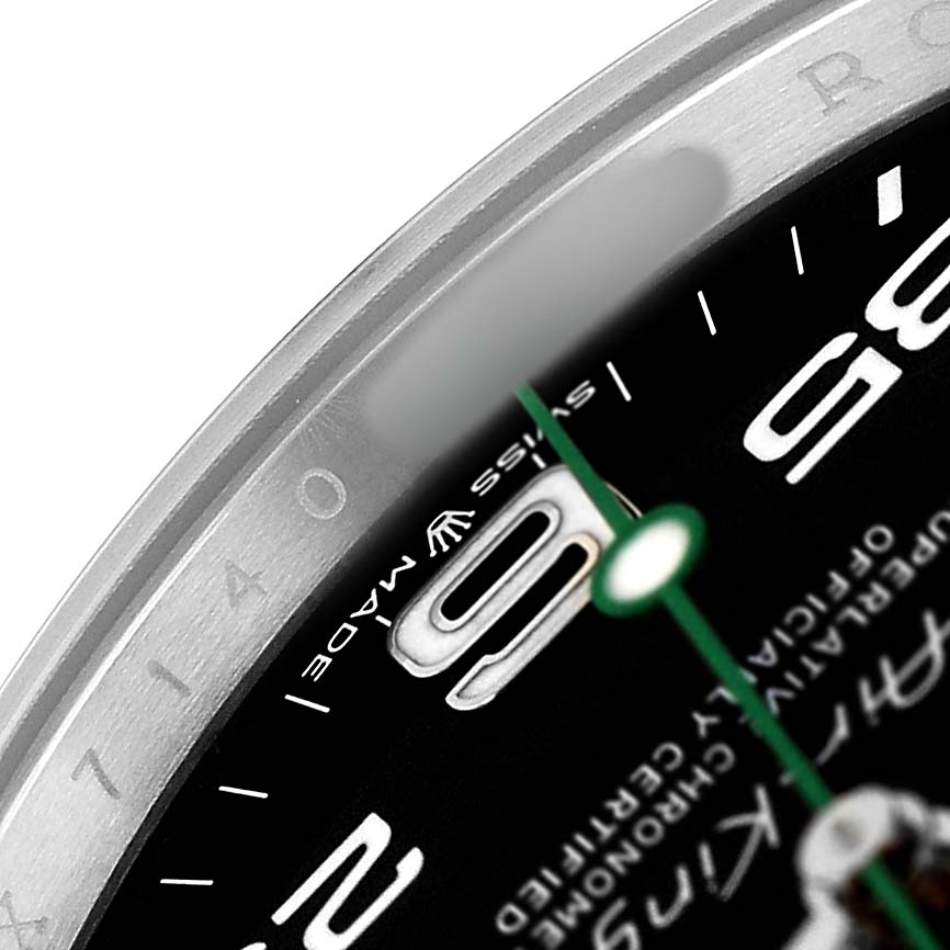 The image shows a close-up of the bezel and dial edge of a Rolex Air-King 126900 Men's Stainless Steel Black Dial, featuring part of the numerals and text.