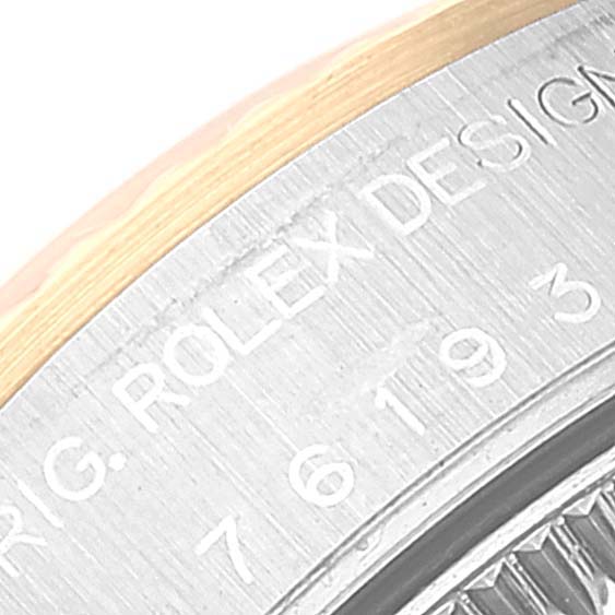 This is a close-up of the bezel and part of the case of a Rolex Oyster Perpetual 76193 Women's Steel and Gold (two tone) Silver Dial 76193 Women's Steel and Gold (two tone) Silver Dial watch.