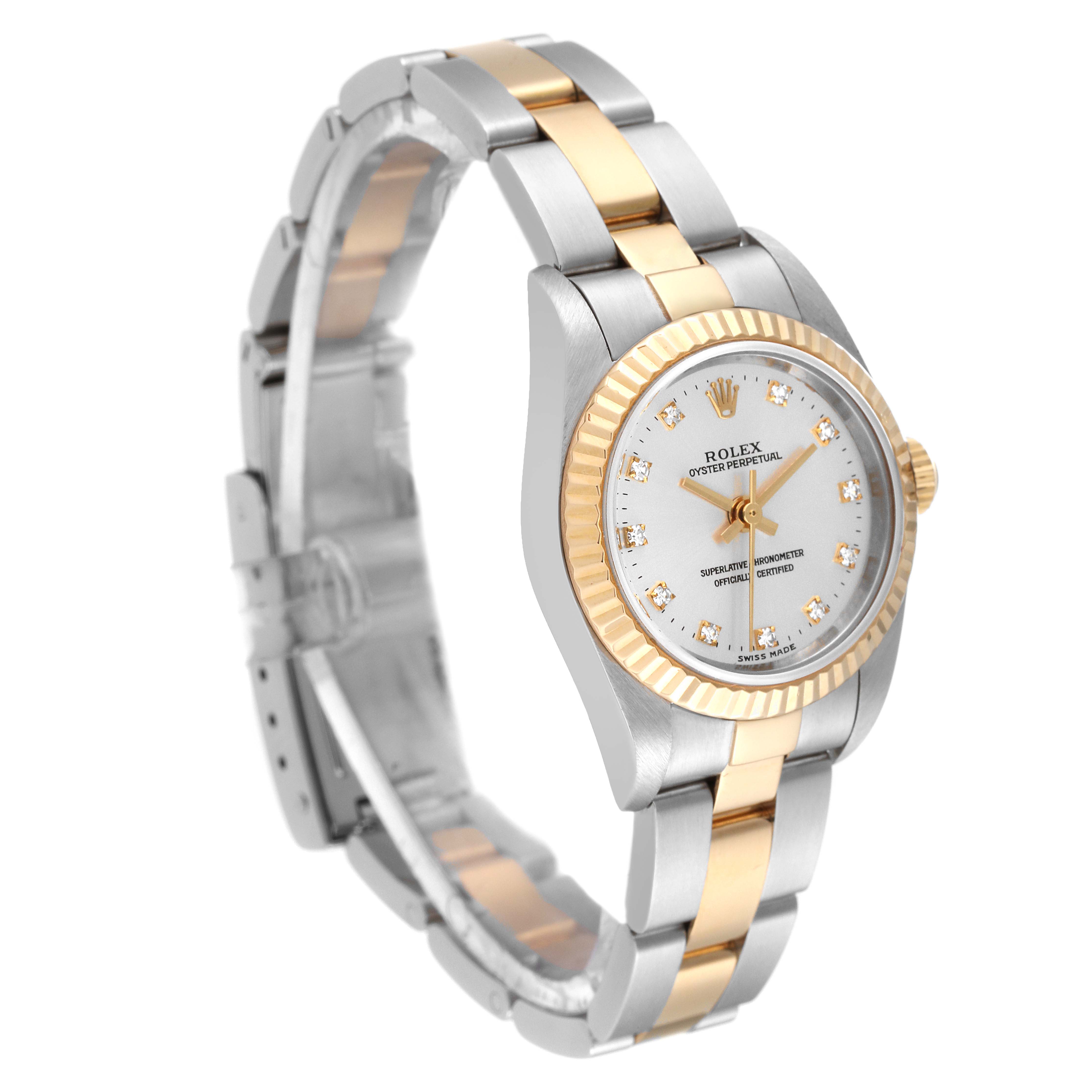 This Rolex Oyster Perpetual 76193 Women's Steel and Gold (two tone) Silver Dial 76193 Women's Steel and Gold (two tone) Silver Dial watch is shown at an angle highlighting its face, two-tone bezel, bracelet, and closed clasp.