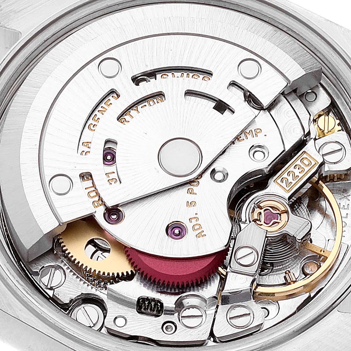 This image shows the movement mechanism of a Rolex Oyster Perpetual 76193 Women's Steel and Gold (two tone) Silver Dial 76193 Women's Steel and Gold (two tone) Silver Dial watch at a close-up angle.