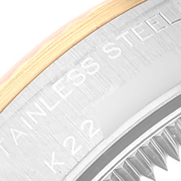 This image shows a close-up of the side edge of the bezel and case of an Oyster Perpetual Rolex watch.