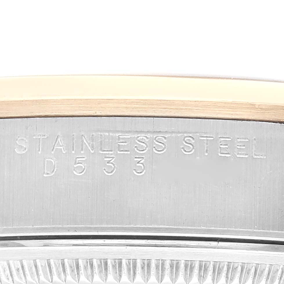 The image shows a close-up of the Stainless Steel marking on the caseback of a Rolex Oyster Perpetual 14203 Men's Steel and Gold (two tone) Grey Dial 14203 Men's Steel and Gold (two tone) Grey Dial watch.