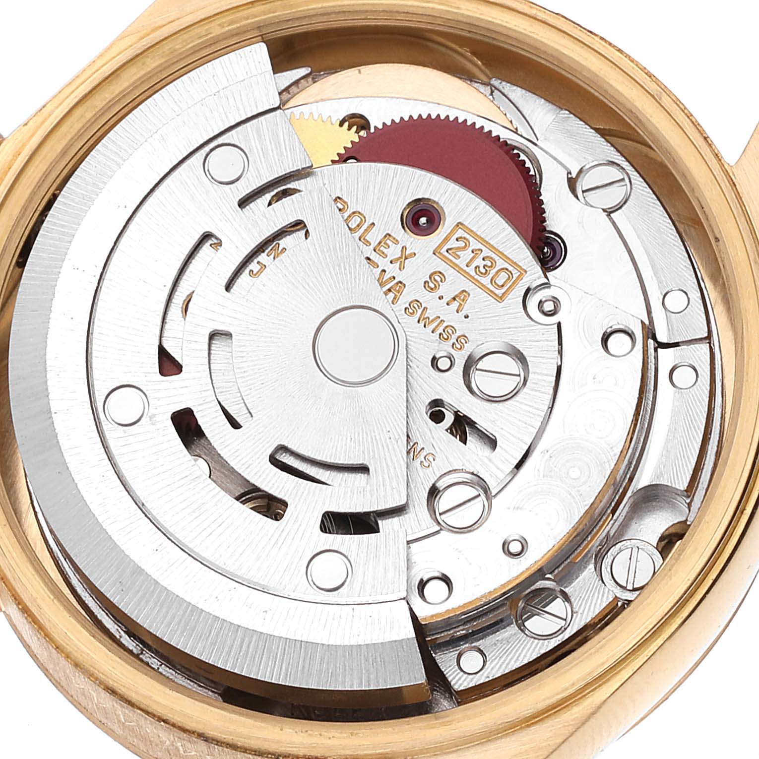 The image shows the intricate movement mechanism of the Rolex President 67188 Women
s Yellow Gold Champagne Dial 67188 Women
s Yellow Gold Champagne Dial model watch from a back angle with the case open.