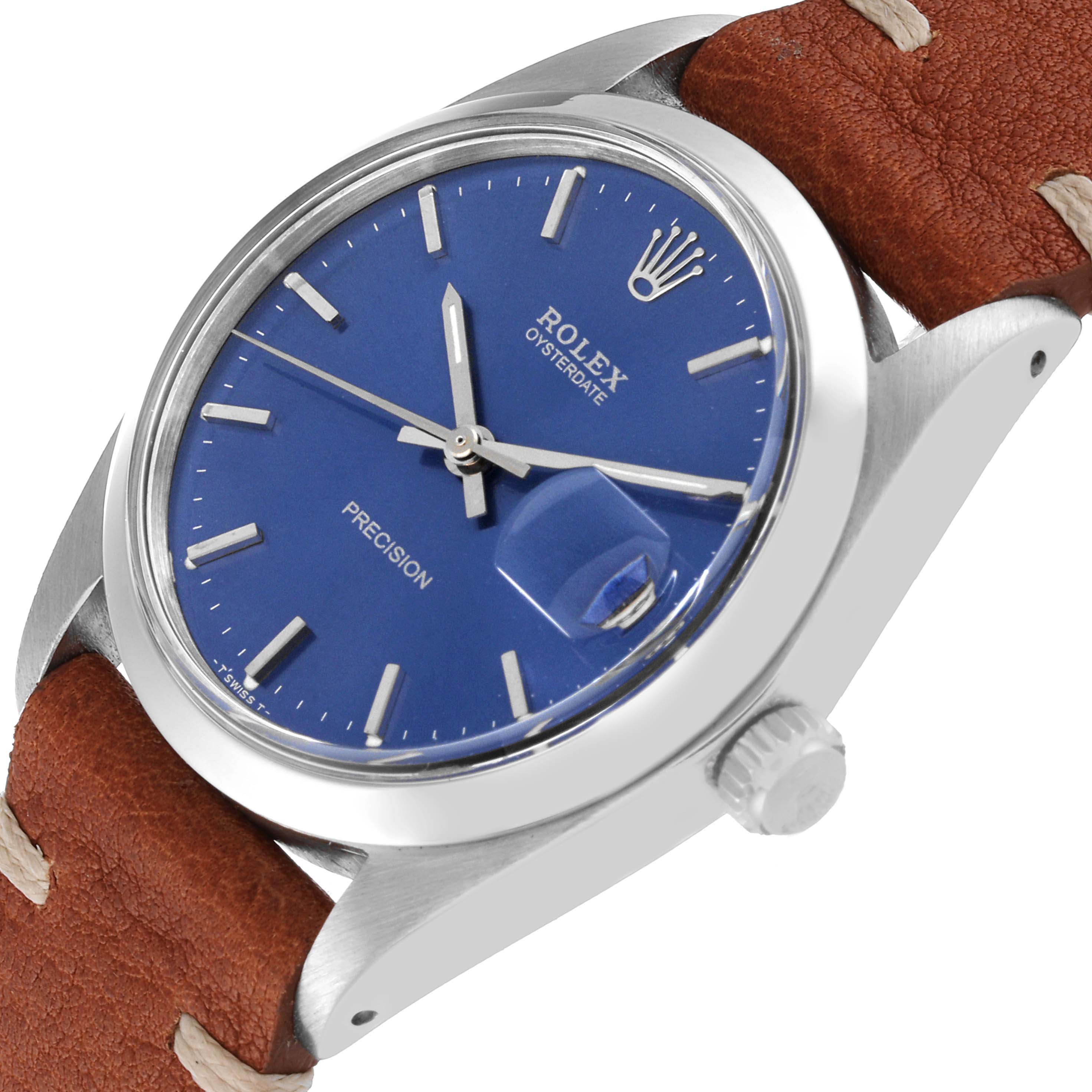 This image shows a Rolex Vintage Collection 6694 Men's Stainless Steel Blue Dial 6694 Men's Stainless Steel Blue Dial watch from a side angle, highlighting its blue dial, crown, and brown leather strap.