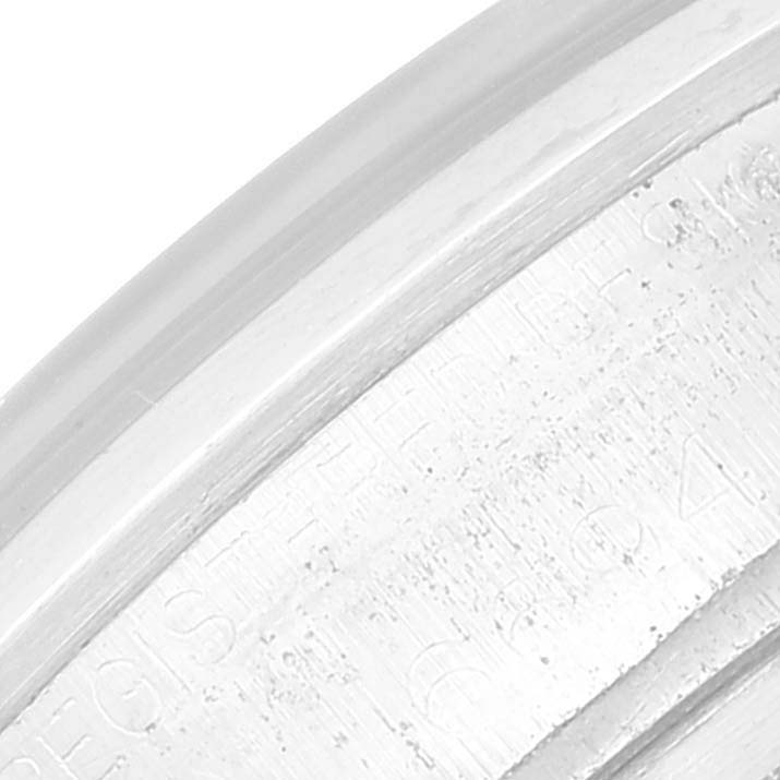 The image shows a close-up angle of the case back's engraved text on the Rolex Vintage Collection 6694 Men's Stainless Steel Blue Dial 6694 Men's Stainless Steel Blue Dial model watch.