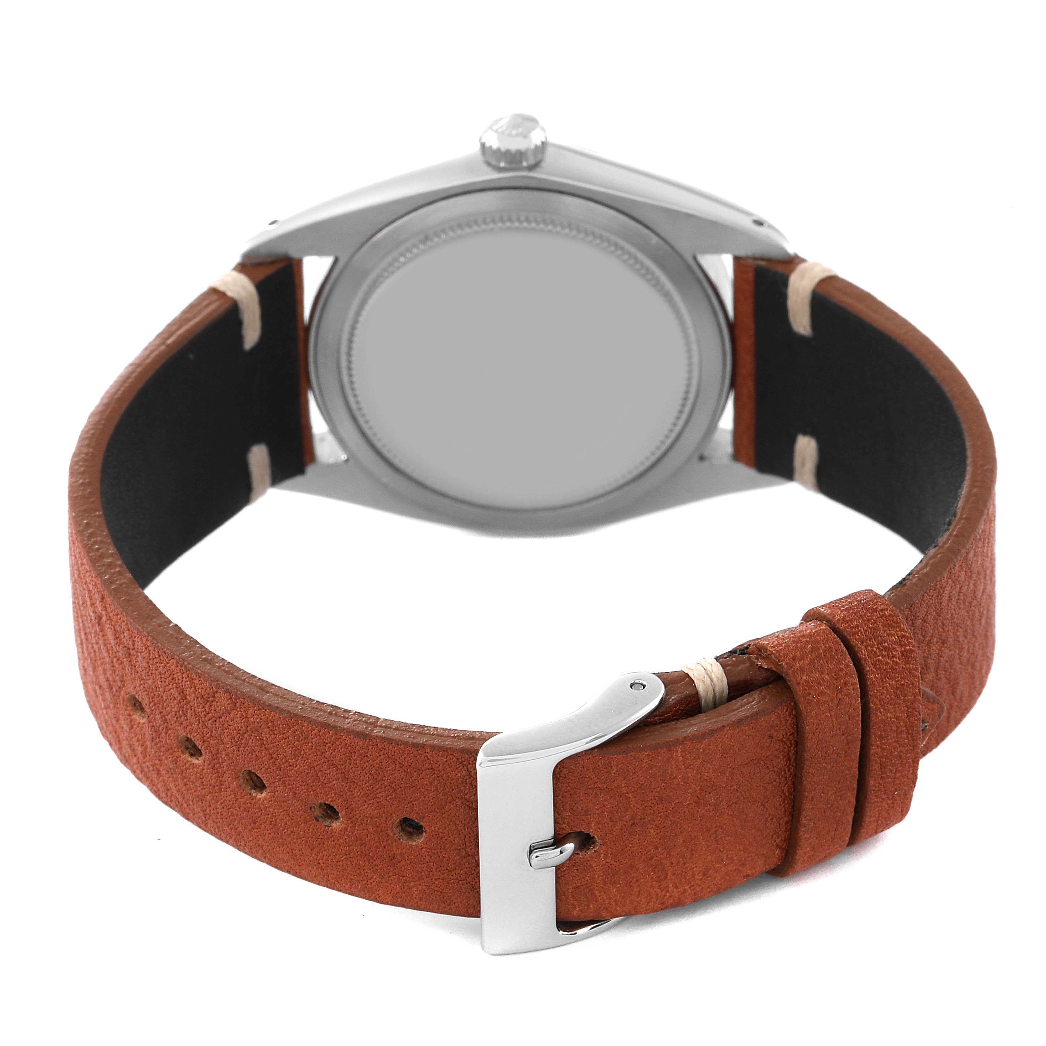 The image shows the back view of a Rolex Vintage Collection 6694 Men's Stainless Steel Blue Dial 6694 Men's Stainless Steel Blue Dial watch with a brown leather strap and silver buckle.