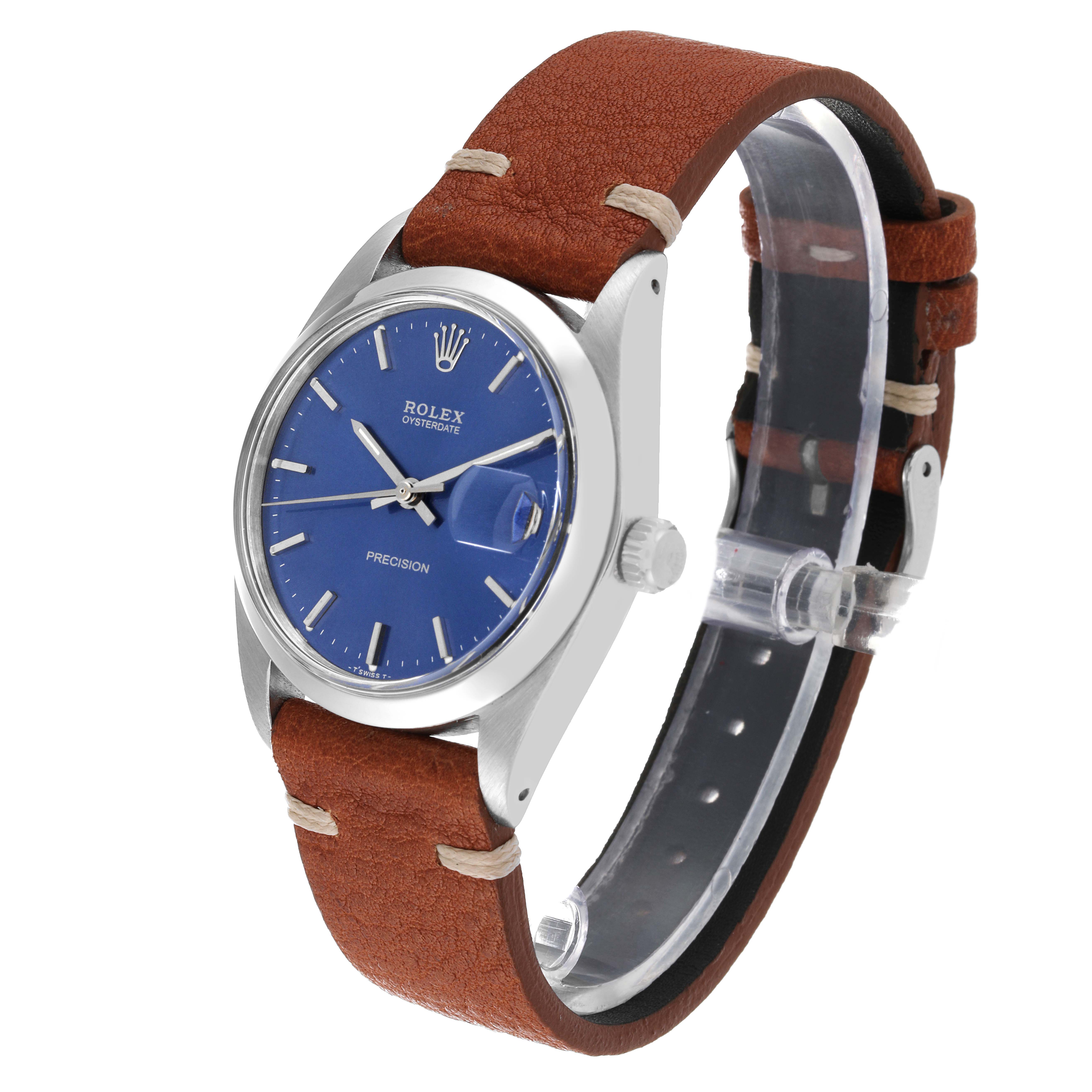 The image shows a Rolex Vintage Collection 6694 Men's Stainless Steel Blue Dial 6694 Men's Stainless Steel Blue Dial watch, featuring a blue dial and brown leather strap, viewed at an angle displaying the face and side.