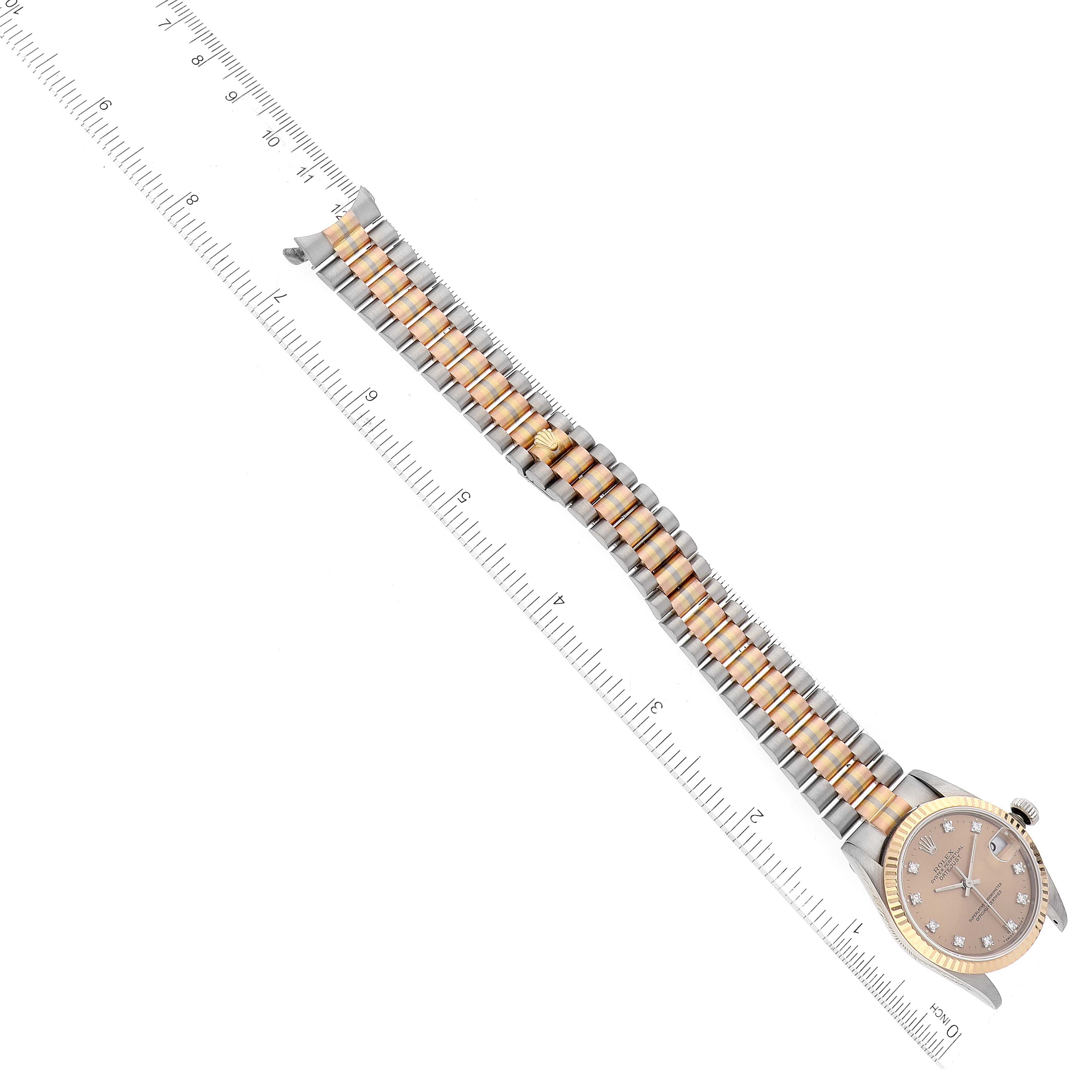 The image shows a Rolex President 68279 Women's White Gold Brown Dial 68279 Women's White Gold Brown Dial model watch laid flat, with a clear view of its face, bezel, and two-tone metal bracelet next to a ruler.