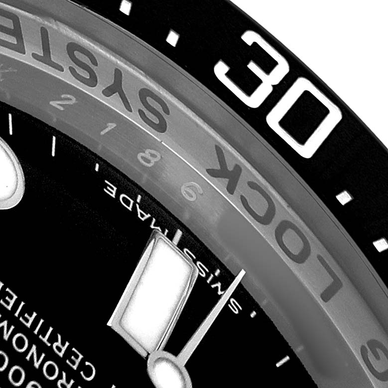 The image shows a close-up angle of the Rolex Sea-Dweller 116660 Men's Stainless Steel Black Dial's dial, bezel, and part of the hour markers.
