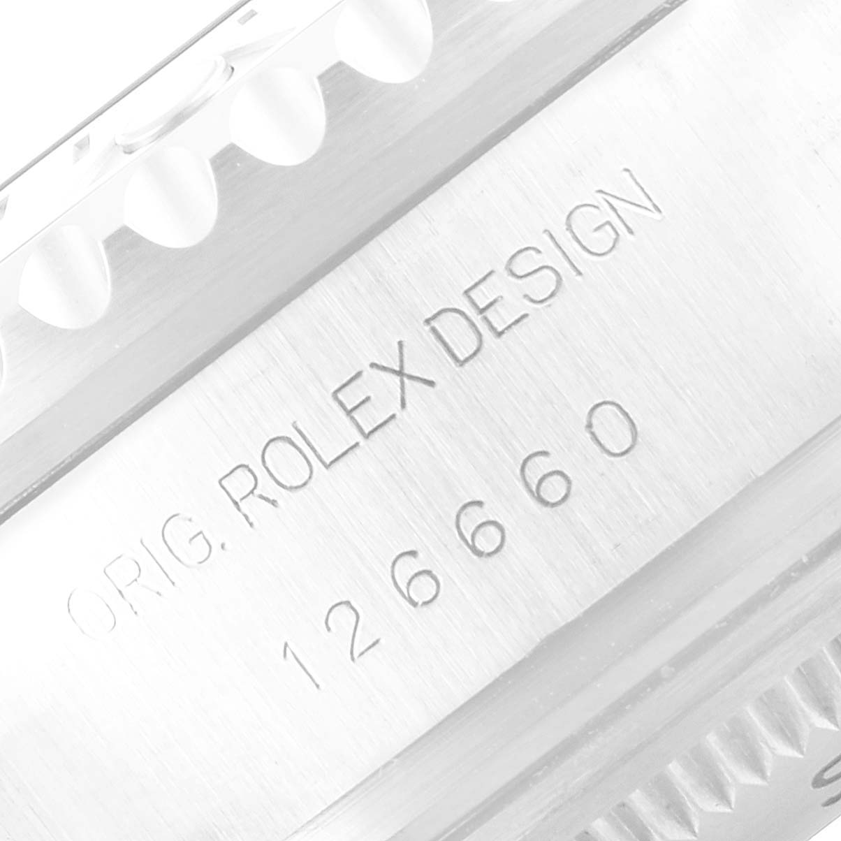 The image shows a close-up of the engraved side of the Rolex Sea-Dweller 126660 Men
s Stainless Steel Black Dial 126660 Men
s Stainless Steel Black Dial watch case, displaying the model number 126660.