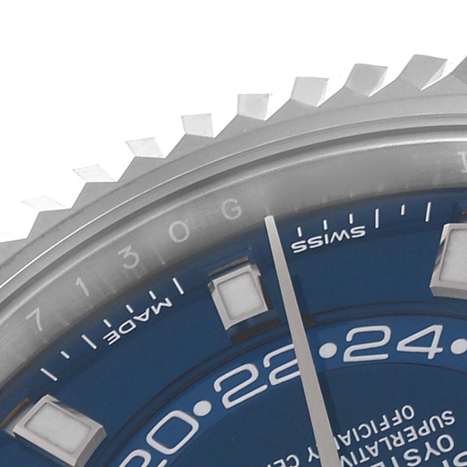 Close-up of the upper bezel, dial, and markers of a Rolex Sky-Dweller 326934 Men's Stainless Steel Blue Dial 326934 Men's Stainless Steel Blue Dial watch.