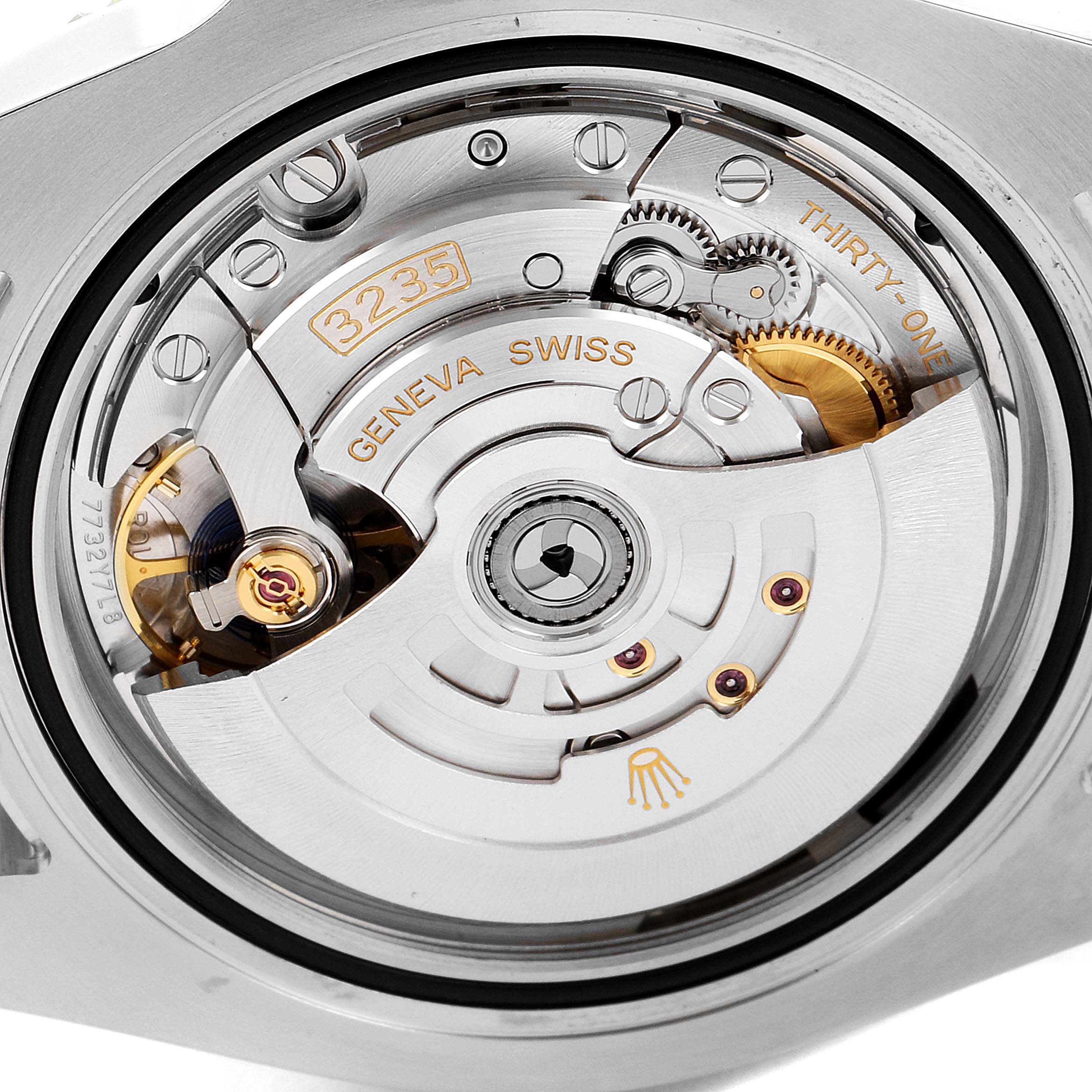 This image shows a close-up view of the movement and inner workings of a Rolex Submariner 126613 Men
s Steel and Gold (two tone) Blue Dial 126613 Men
s Steel and Gold (two tone) Blue Dial watch.