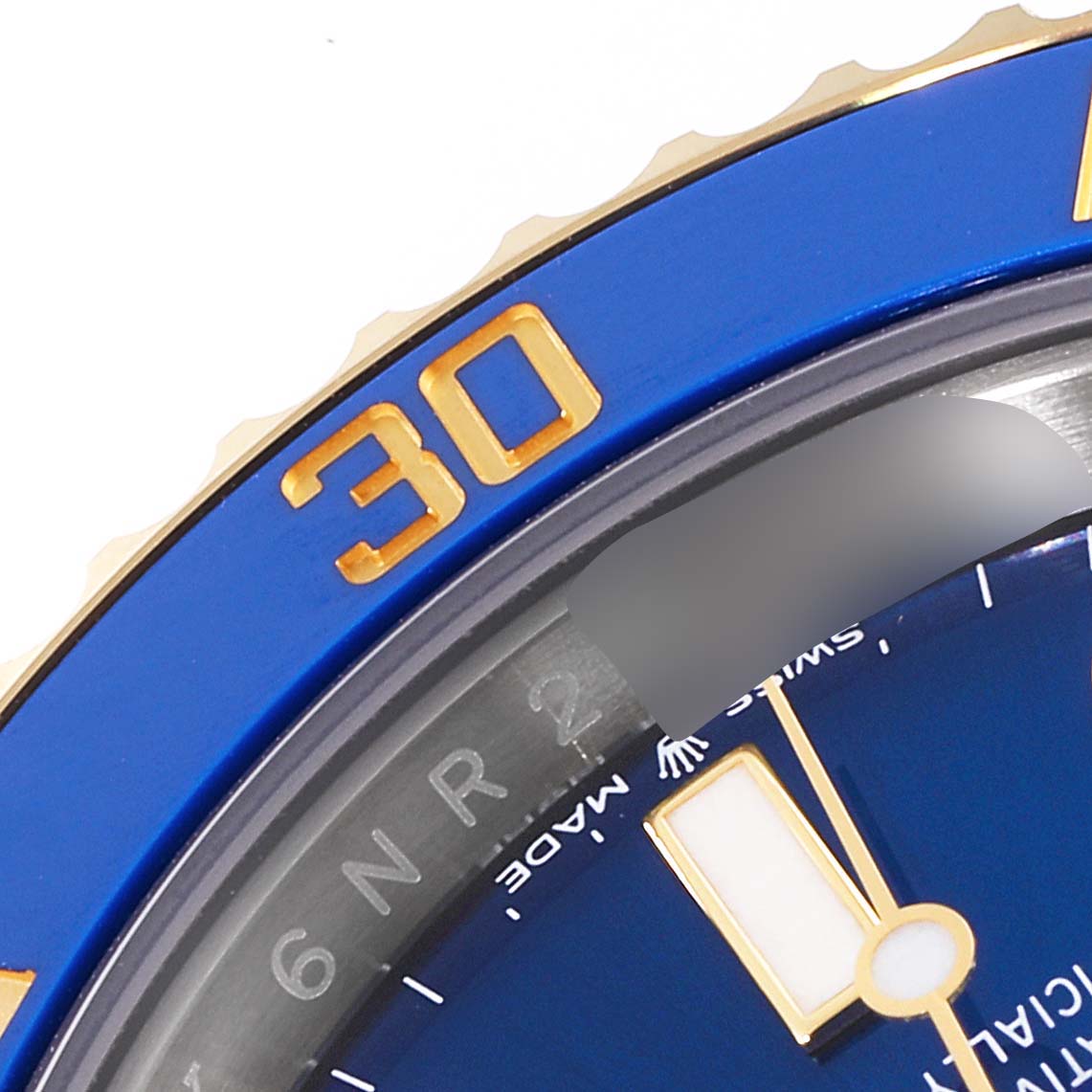 This image shows a close-up of the dial and bezel of a Rolex Submariner 126613 Men
s Steel and Gold (two tone) Blue Dial 126613 Men
s Steel and Gold (two tone) Blue Dial watch, emphasizing the blue and gold details.
