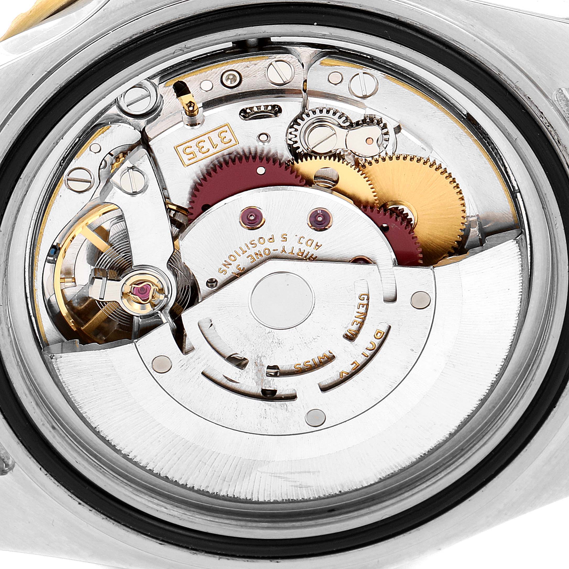 This image shows the internal movement mechanism of a Rolex Submariner 16613 Men's Steel and Gold (two tone) Black Dial 16613 Men's Steel and Gold (two tone) Black Dial watch from a rear angle.