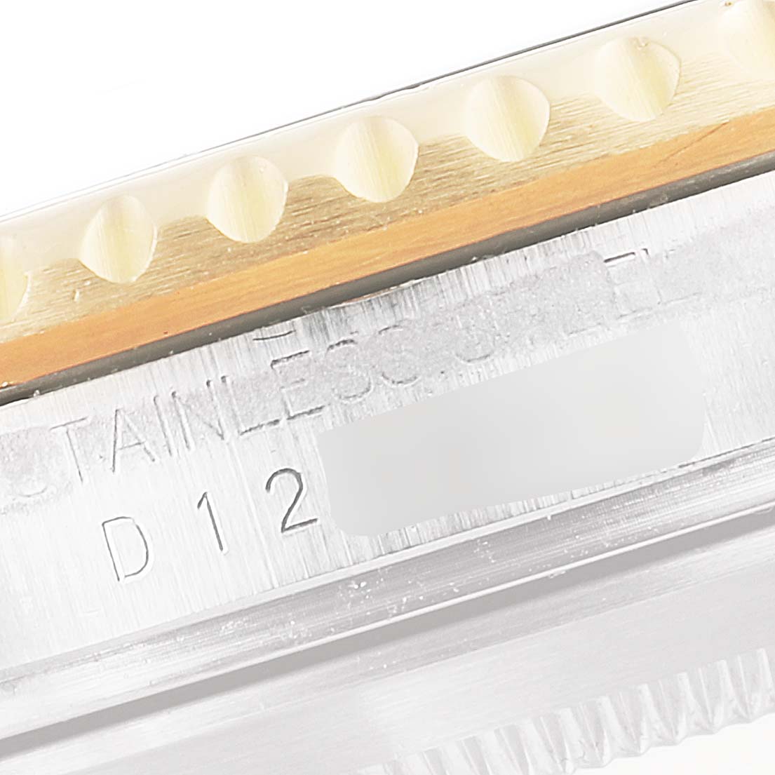 This close-up image shows the edge and part of the bezel of a Rolex Submariner 16613 Men's Steel and Gold (two tone) Black Dial 16613 Men's Steel and Gold (two tone) Black Dial watch.