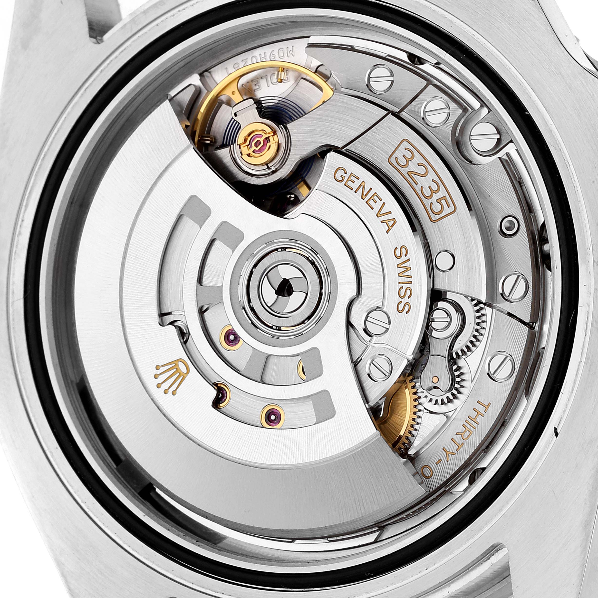 The image shows the internal movement mechanism of a Rolex Submariner 126610 Men
s Stainless Steel Black Dial 126610 Men
s Stainless Steel Black Dial watch from a rear angle, revealing the intricate gears and components.