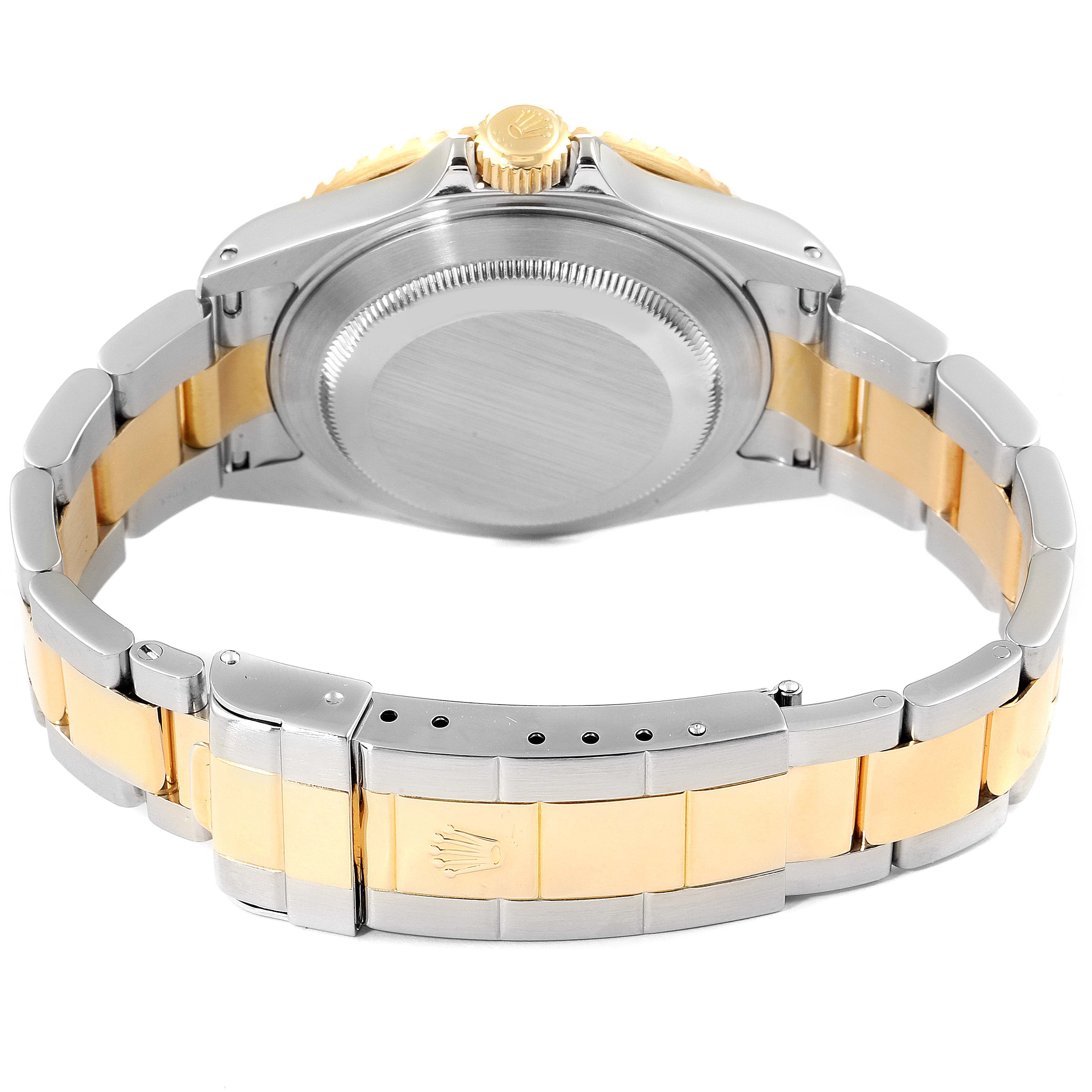 The image shows the case back, crown, and two-tone bracelet of a Rolex Submariner 16613 Men's Steel and Gold (two tone) Blue Dial 16613 Men's Steel and Gold (two tone) Blue Dial watch from a rear angle.