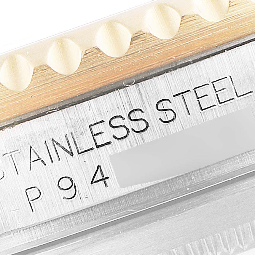 A close-up image shows the bezel edge and part of the case with "STAINLESS STEEL" engraved on the Rolex Submariner 16613 Men's Steel and Gold (two tone) Blue Dial 16613 Men's Steel and Gold (two tone) Blue Dial model.