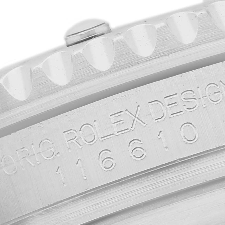 The image shows an angled view of a Rolex Submariner 116610 Men's Stainless Steel Black Dial's watch case with its engraved model number and design details.