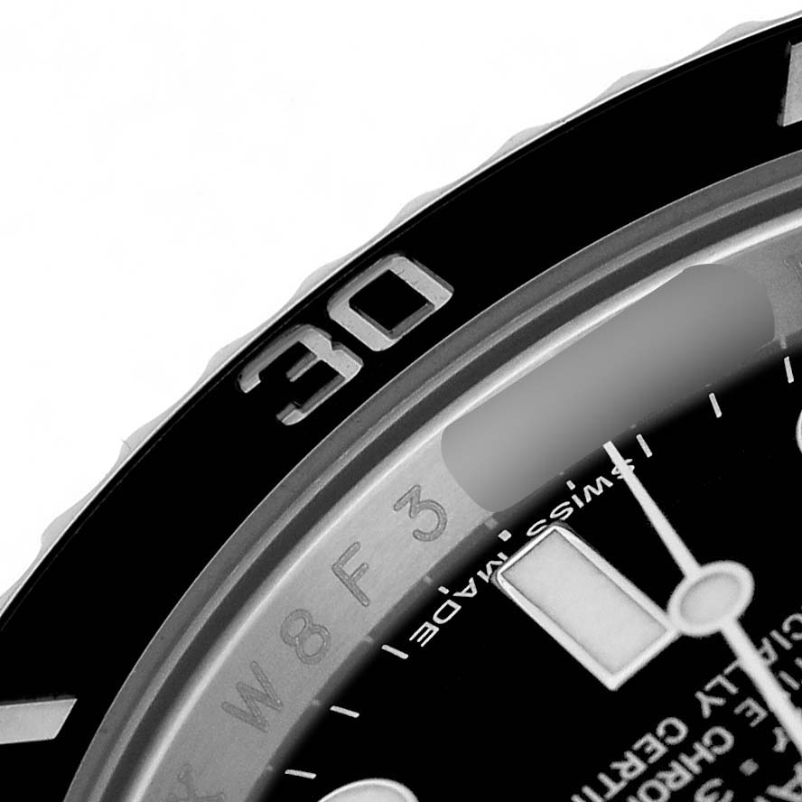 The image shows a close-up of the bezel and part of the dial of a Rolex Submariner 116610 Men's Stainless Steel Black Dial, highlighting the number "30."