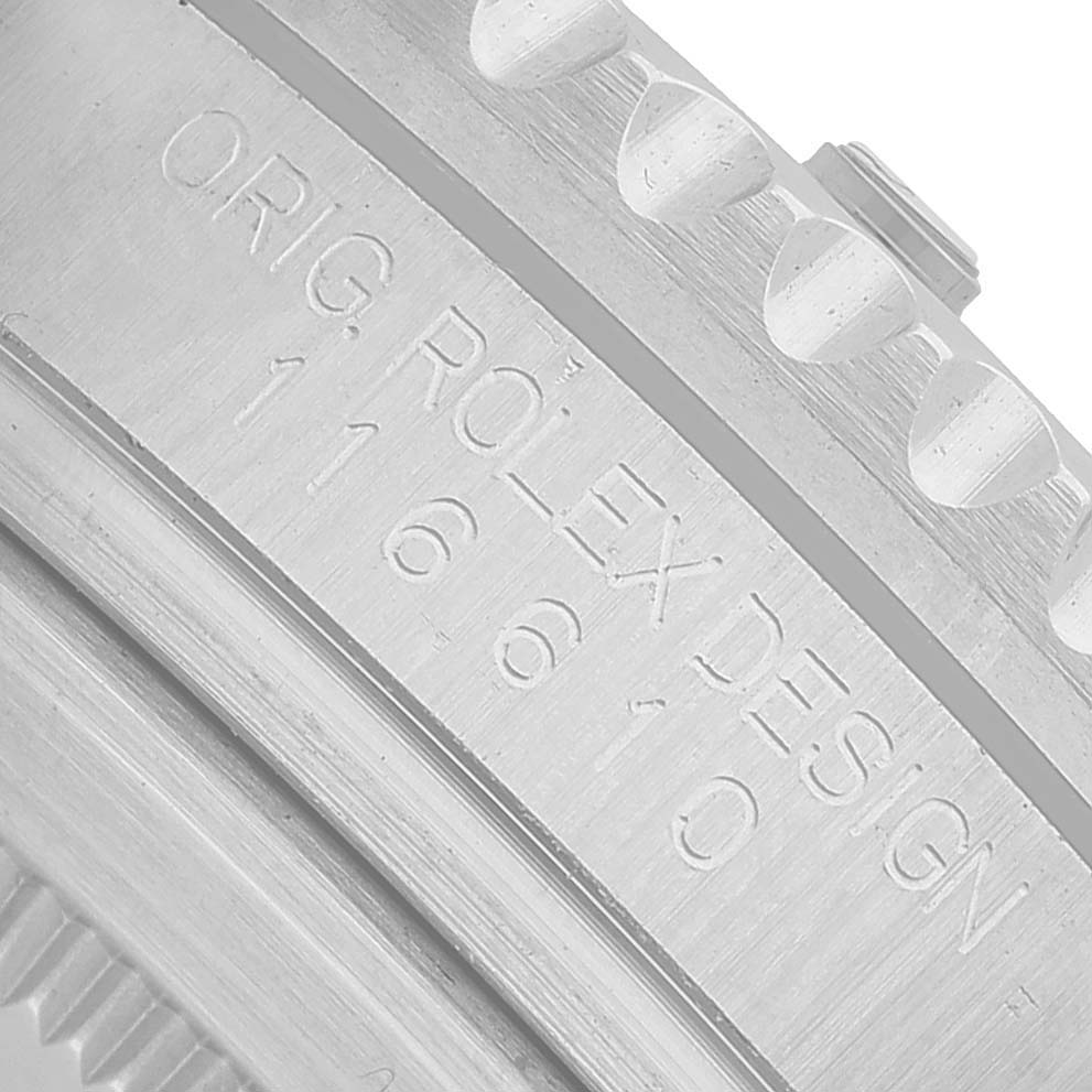 The image shows a close-up of the engraved side of a Rolex Submariner 116610 Men's Stainless Steel Black Dial's case with the model number visible.