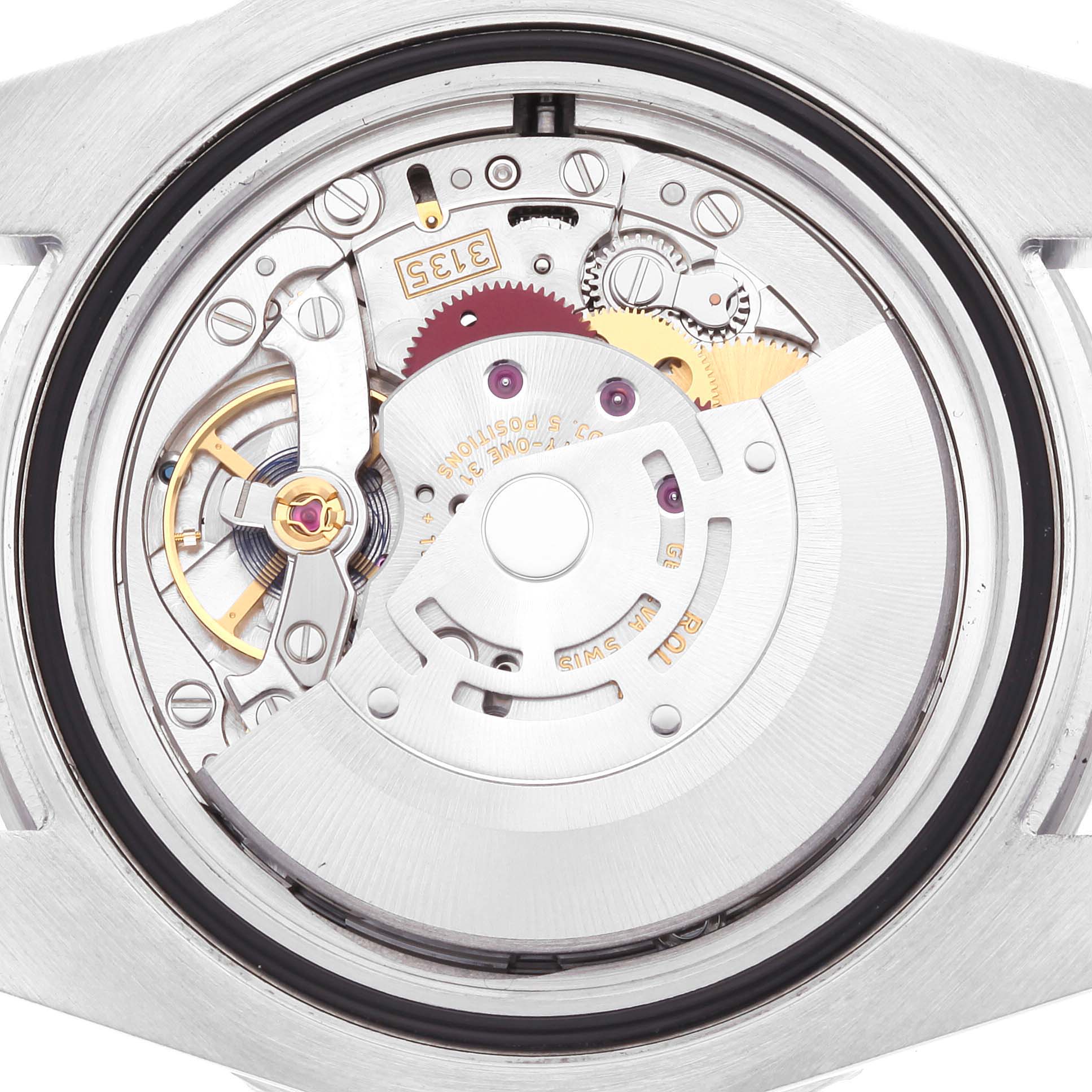 This image shows the internal movement mechanism of a Rolex Submariner 116610LV Men
s Stainless Steel Green Dial 116610LV Men
s Stainless Steel Green Dial watch from a back angle.