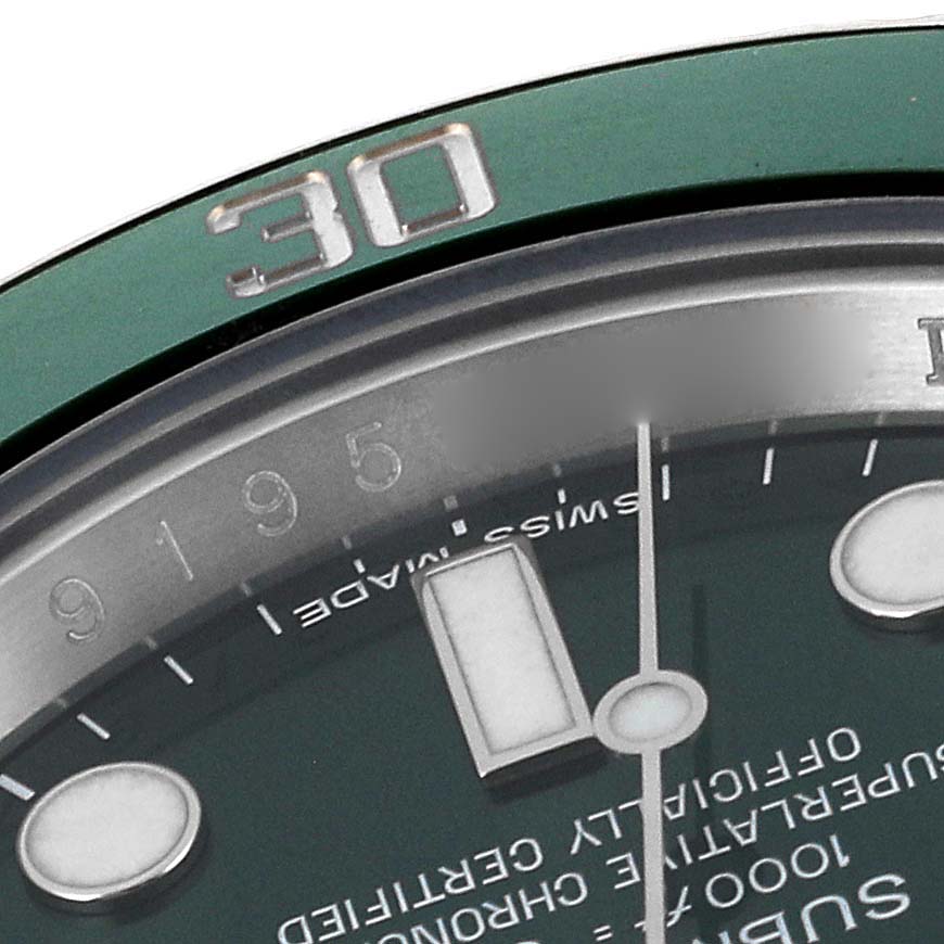 This close-up angle of a Rolex Submariner 116610LV Men
s Stainless Steel Green Dial 116610LV Men
s Stainless Steel Green Dial shows part of the green bezel, dial, minute hand, and hour markers.