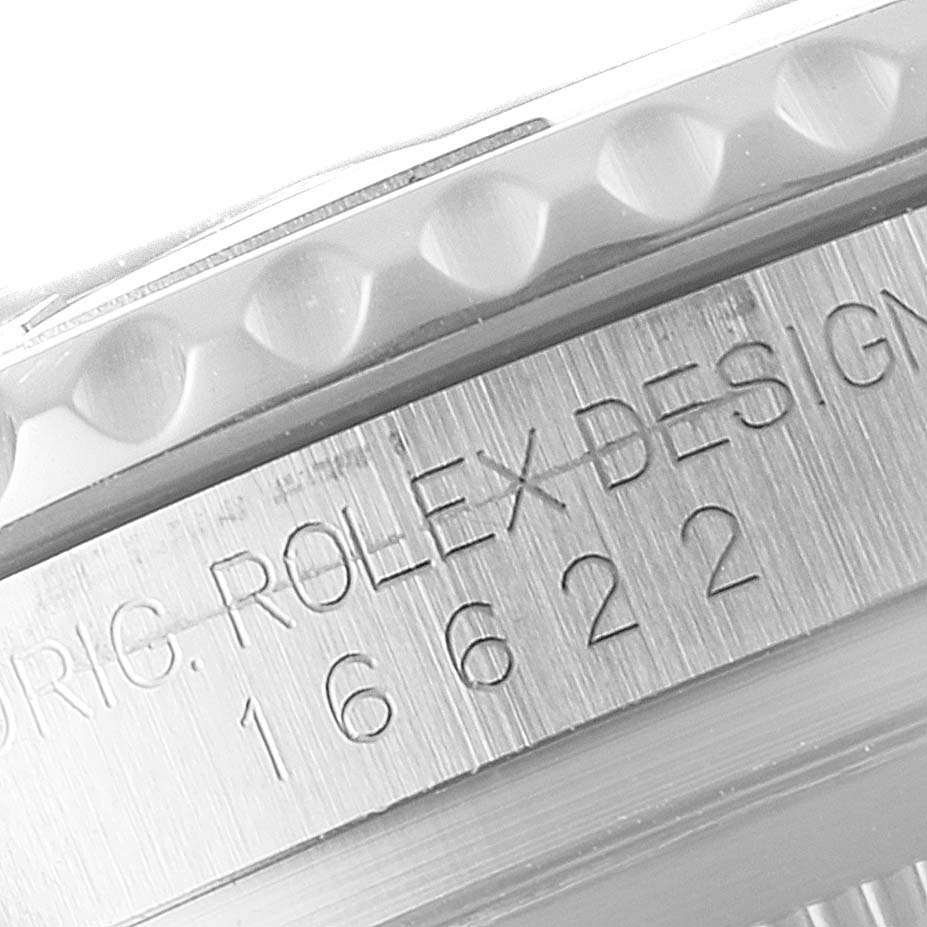 This close-up image shows the engraved model number and part of the bezel of a Rolex Yacht-Master 16622 Men's Stainless Steel Silver Dial 16622 Men's Stainless Steel Silver Dial watch.