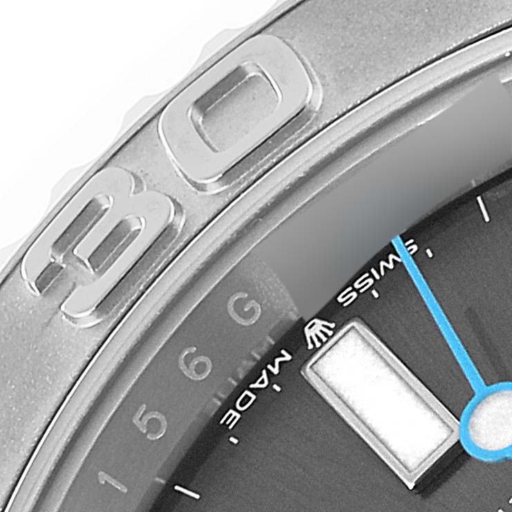 This close-up image of the Rolex Yacht-Master 126622 Men
s Stainless Steel Grey Dial 126622 Men
s Stainless Steel Grey Dial watch shows a portion of its bezel, dial, and a blue second hand.