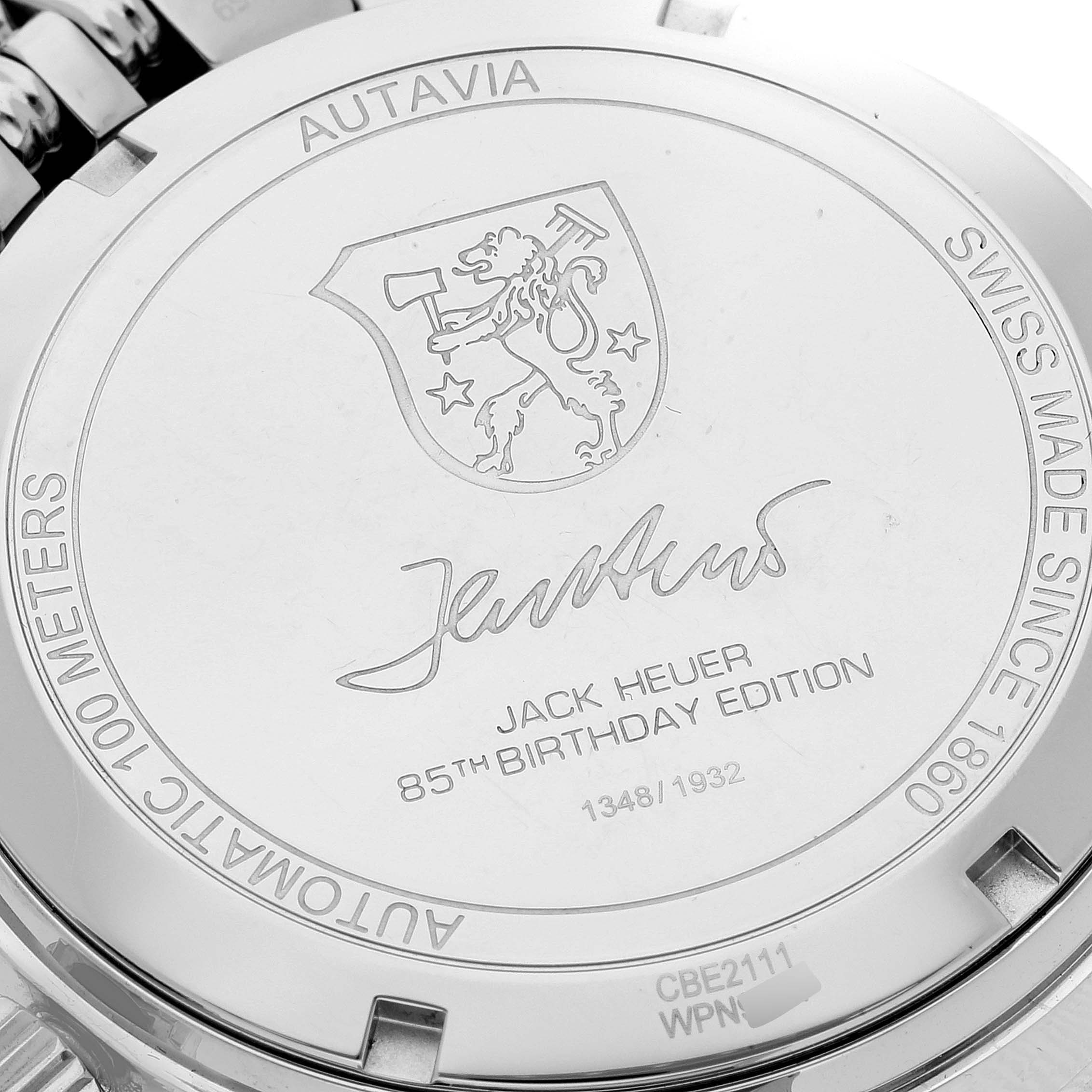 This image shows the back case of a Tag Heuer Autavia CBE2111.BA0687 Men's Stainless Steel Silver Dial CBE2111.BA0687 Men's Stainless Steel Silver Dial watch, highlighting the engraving for the Jack Heuer 85th Birthday Edition.