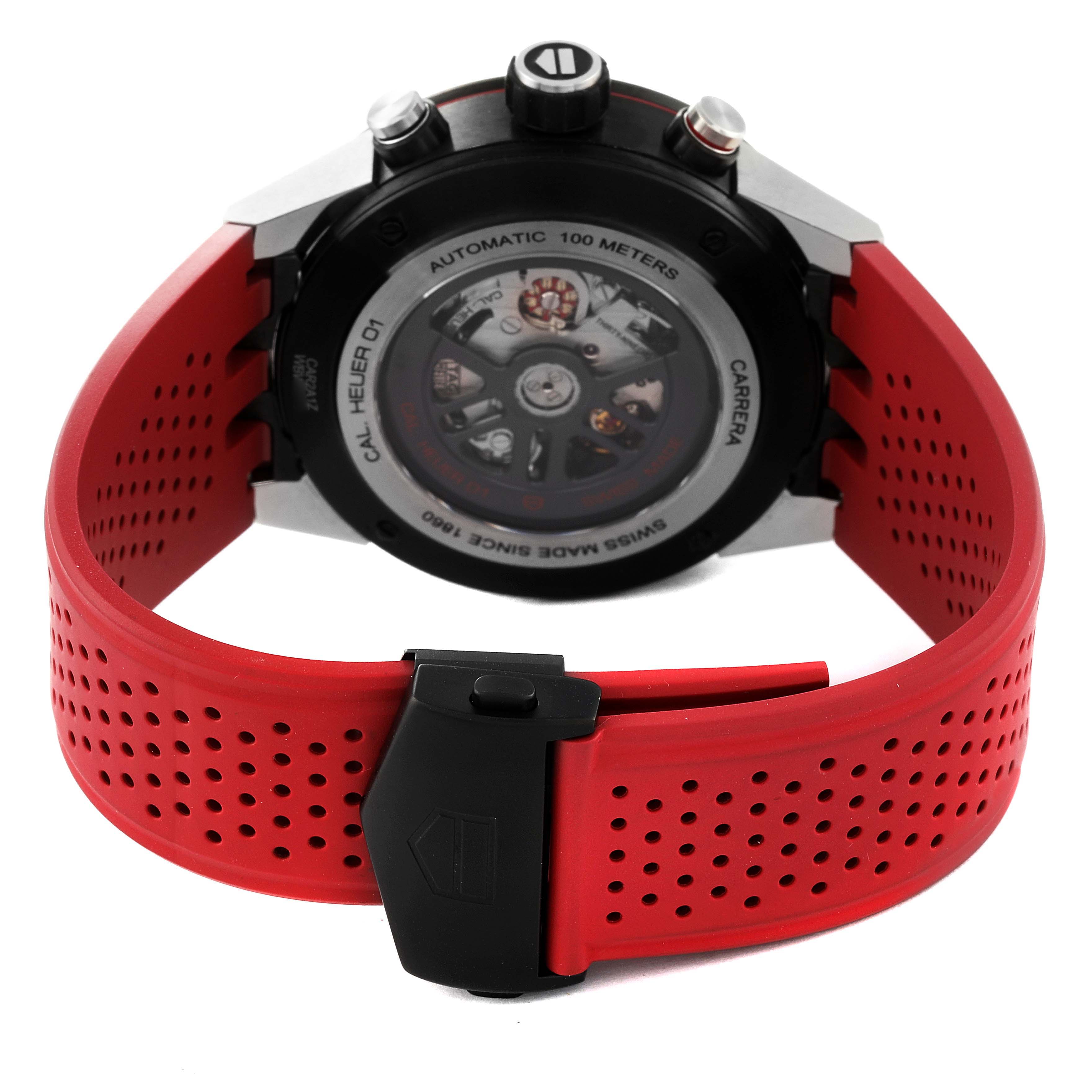 This image shows the back view of a Tag Heuer Carrera CAR2A1Z Men
s Stainless Steel Black Dial CAR2A1Z Men
s Stainless Steel Black Dial watch with a red perforated strap and visible mechanical movement.