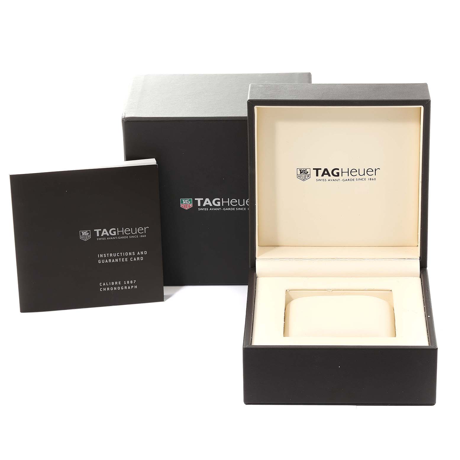 This image shows a Tag Heuer Carrera CAR2A1Z Men
s Stainless Steel Black Dial CAR2A1Z Men
s Stainless Steel Black Dial watch box, outer box, and an instruction manual with a guarantee card.