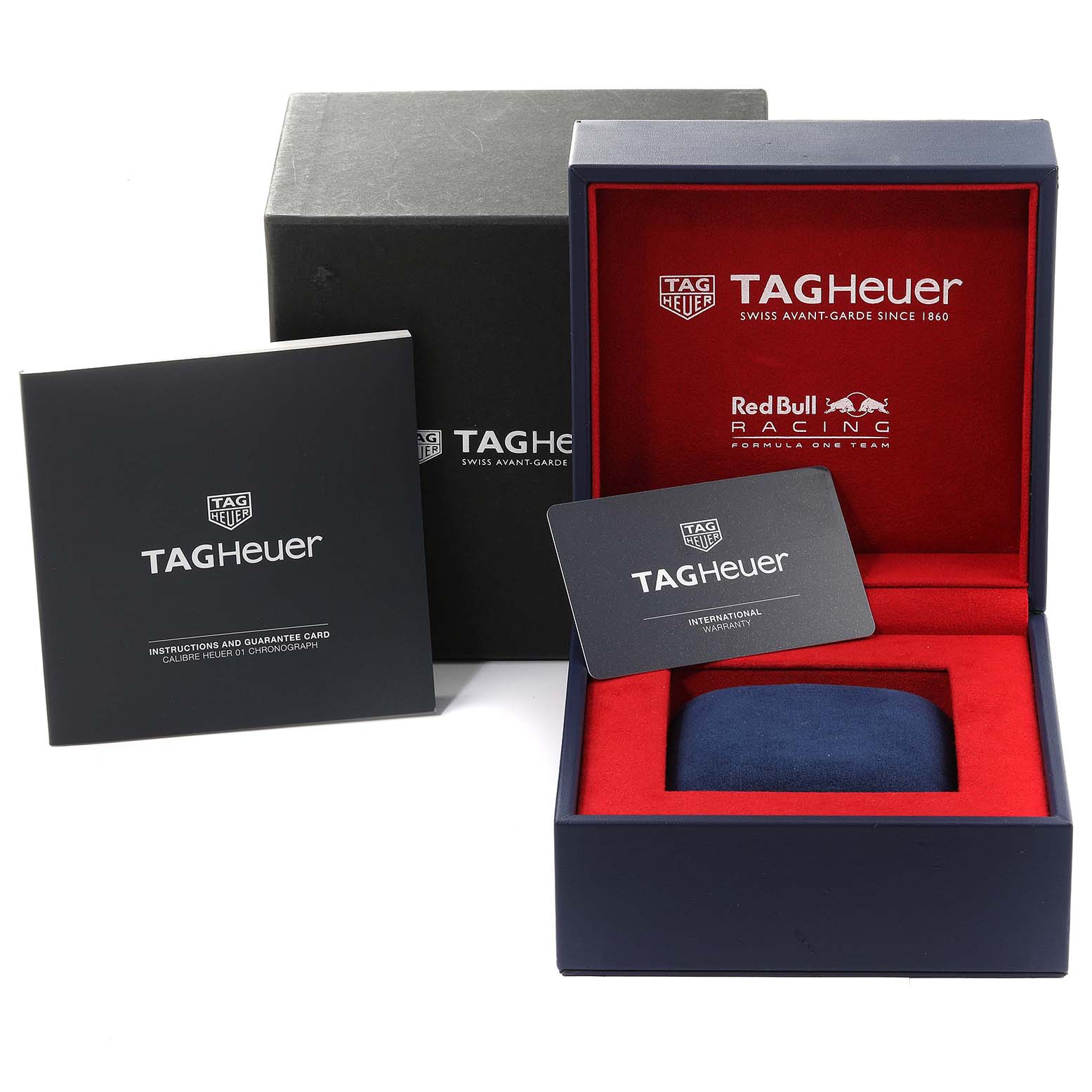 The image shows a Tag Heuer Carrera CAR2A1N.FT6100 Men's Stainless Steel Blue Dial CAR2A1N.FT6100 Men's Stainless Steel Blue Dial watch box, instruction booklet, warranty card, and outer packaging.