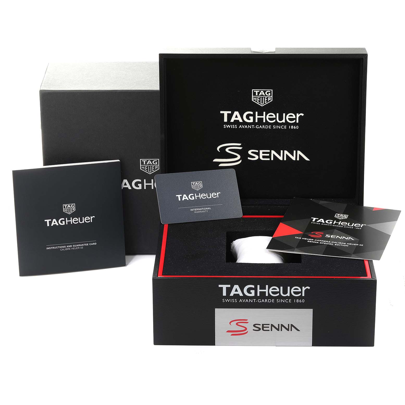 The image shows the Tag Heuer Carrera CBG2013 Men's Stainless Steel Transparent Dial CBG2013 Men's Stainless Steel Transparent Dial watch packaging, including the box, booklet, guarantee card, and branded inserts.