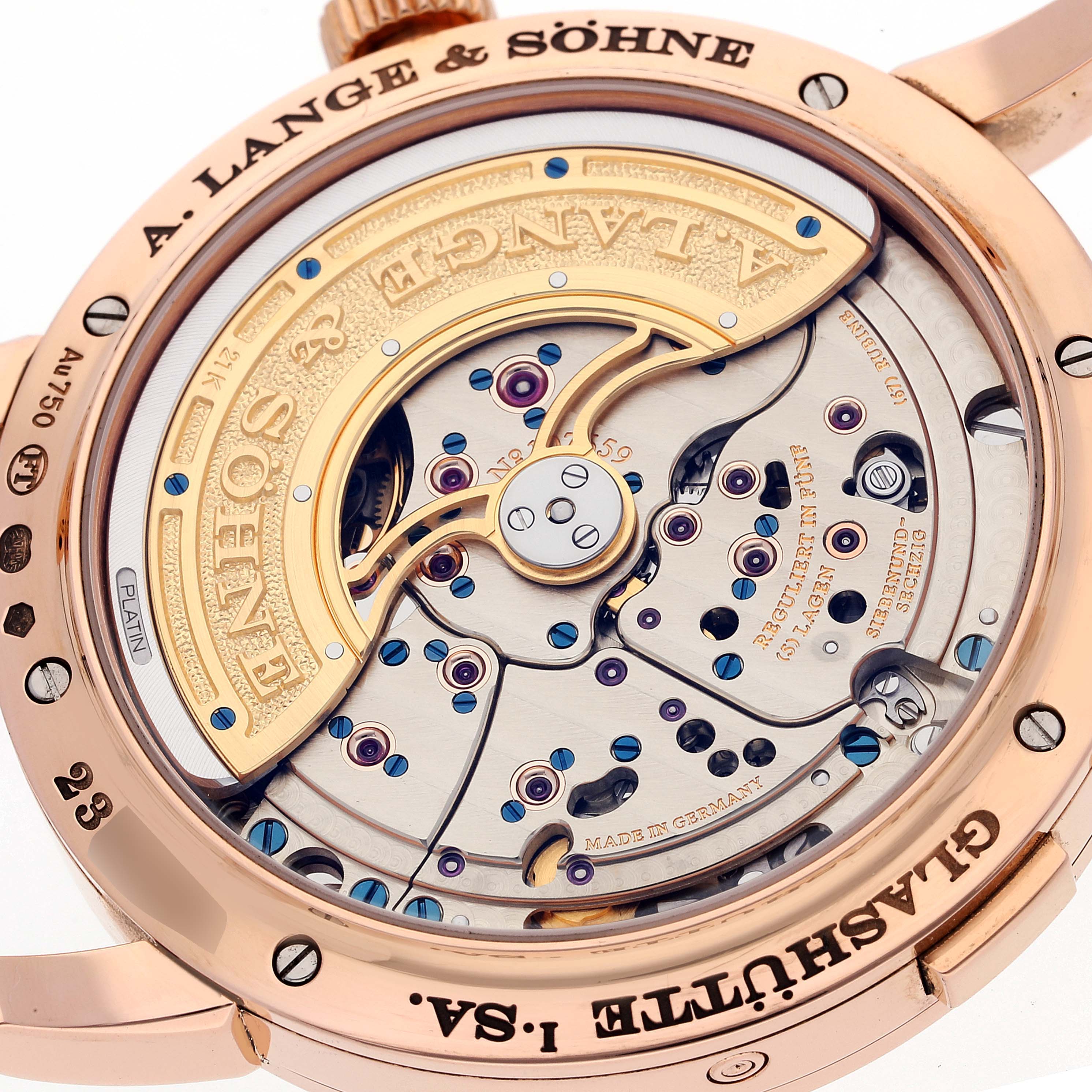 The image shows a close-up of the movement and engraving on the caseback of the Lange 1 model by A. Lange & Söhne.