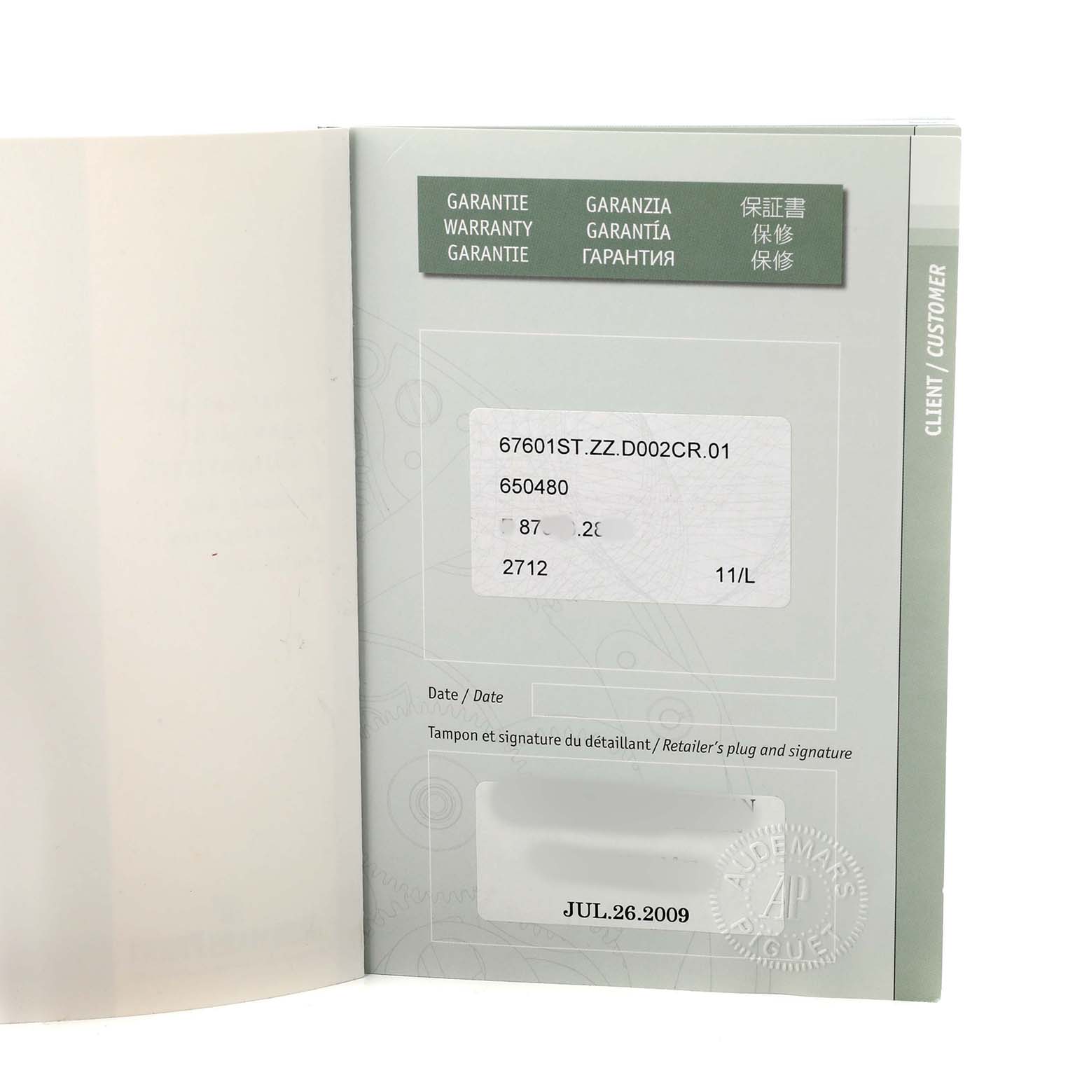 The image shows a warranty booklet for an Audemars Piguet Royal Oak 67601ST.ZZ.D002CR.01 Women's Stainless Steel Black Dial watch, open to display the warranty information and date.