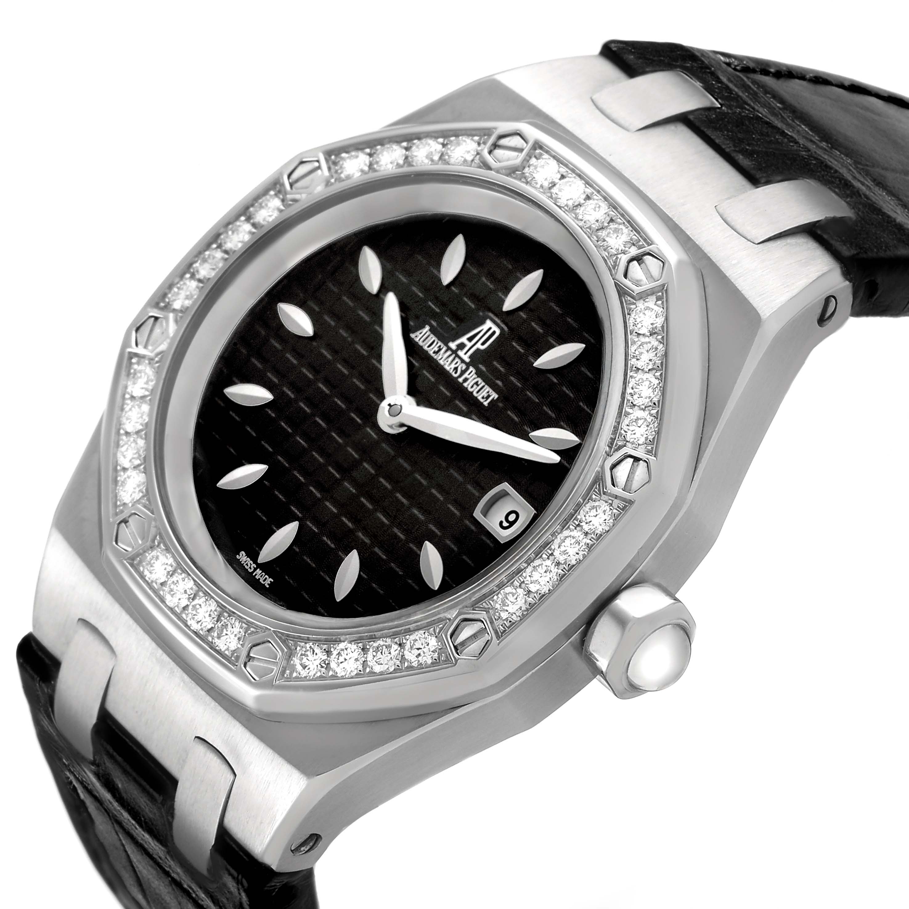 The Audemars Piguet Royal Oak 67601ST.ZZ.D002CR.01 Women's Stainless Steel Black Dial watch is shown at an angle highlighting its diamond-set bezel, black textured dial, and leather strap.