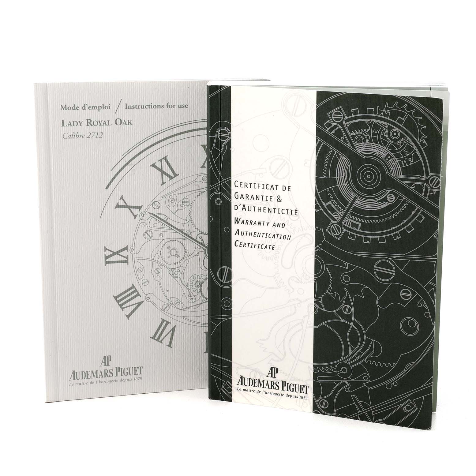 The image shows instruction and warranty booklets for the Audemars Piguet Lady Royal Oak watch model.