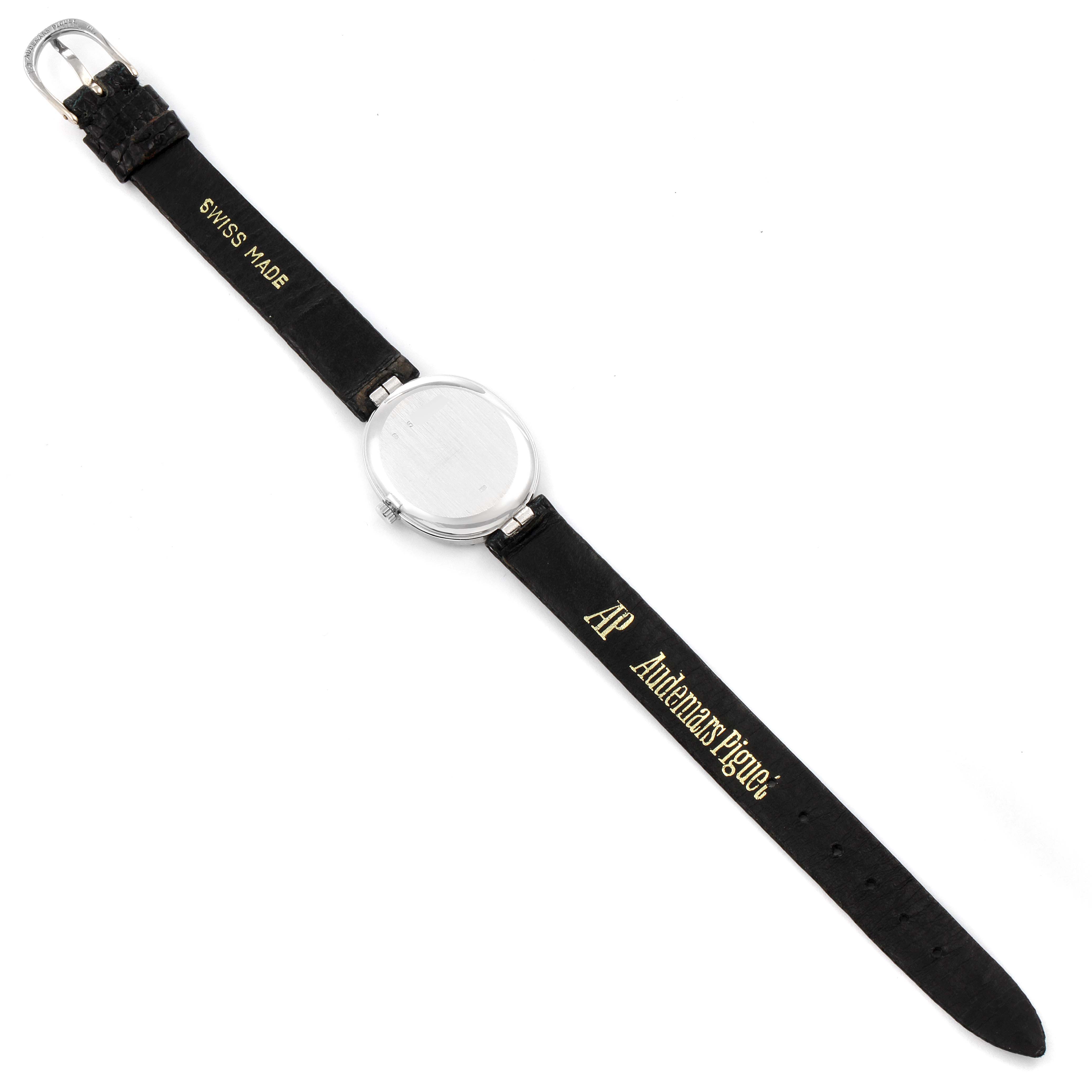 The image shows the full front view of a vintage Audemars Piguet watch with its strap extended flat.