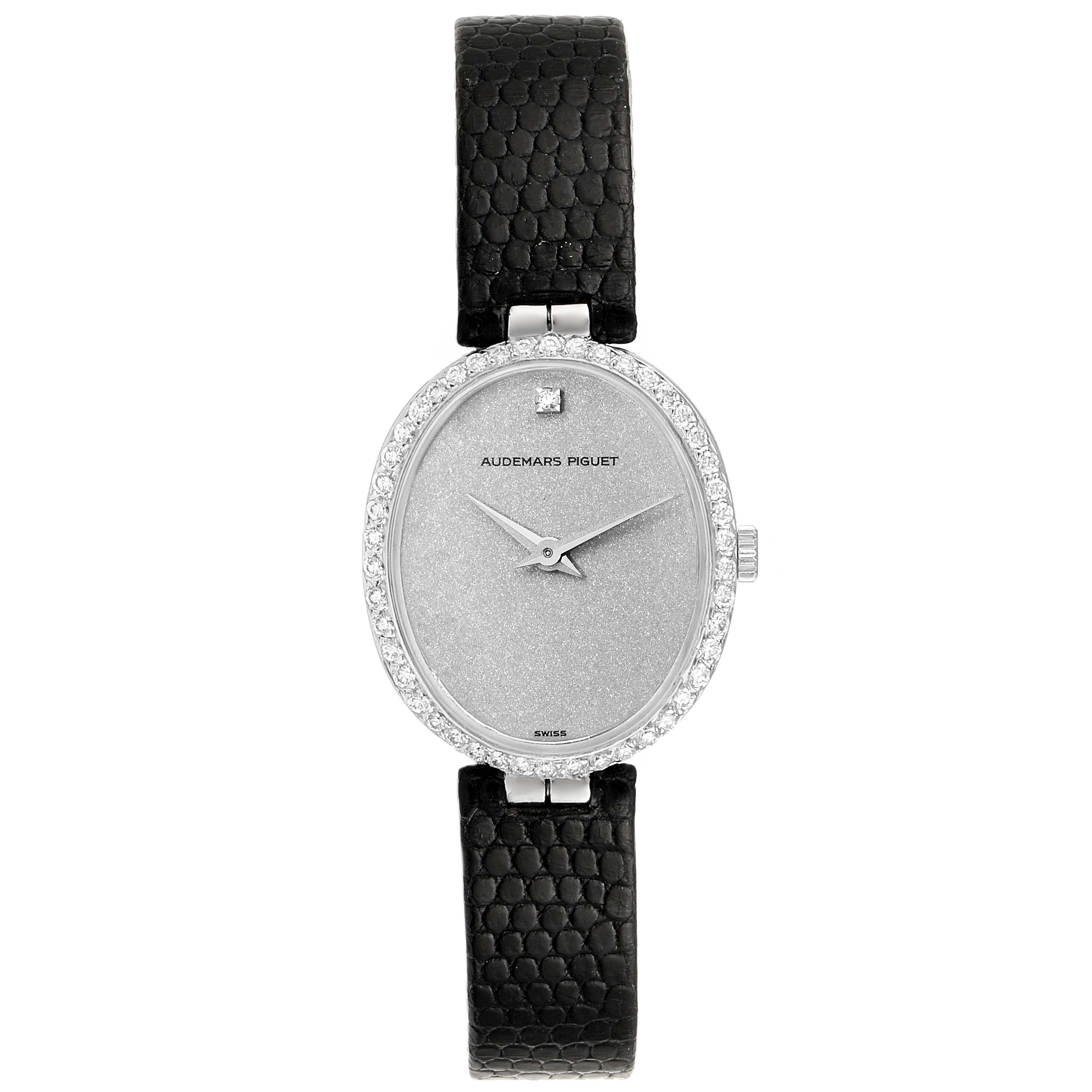 The image shows a front view of a Vintage Audemars Piguet watch with a silver oval face and black leather strap.