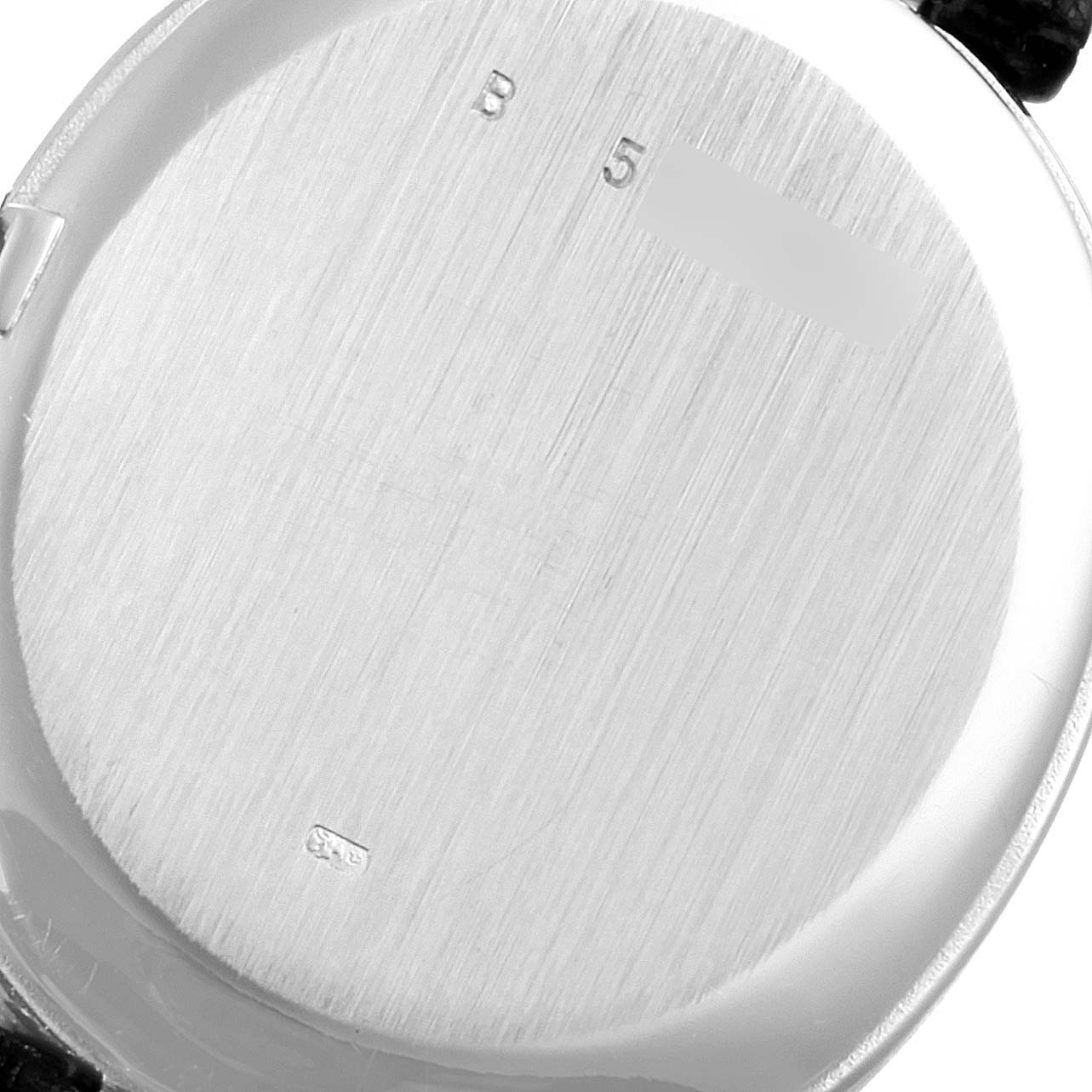 The image shows the back case of a vintage Audemars Piguet watch from a close-up angle.