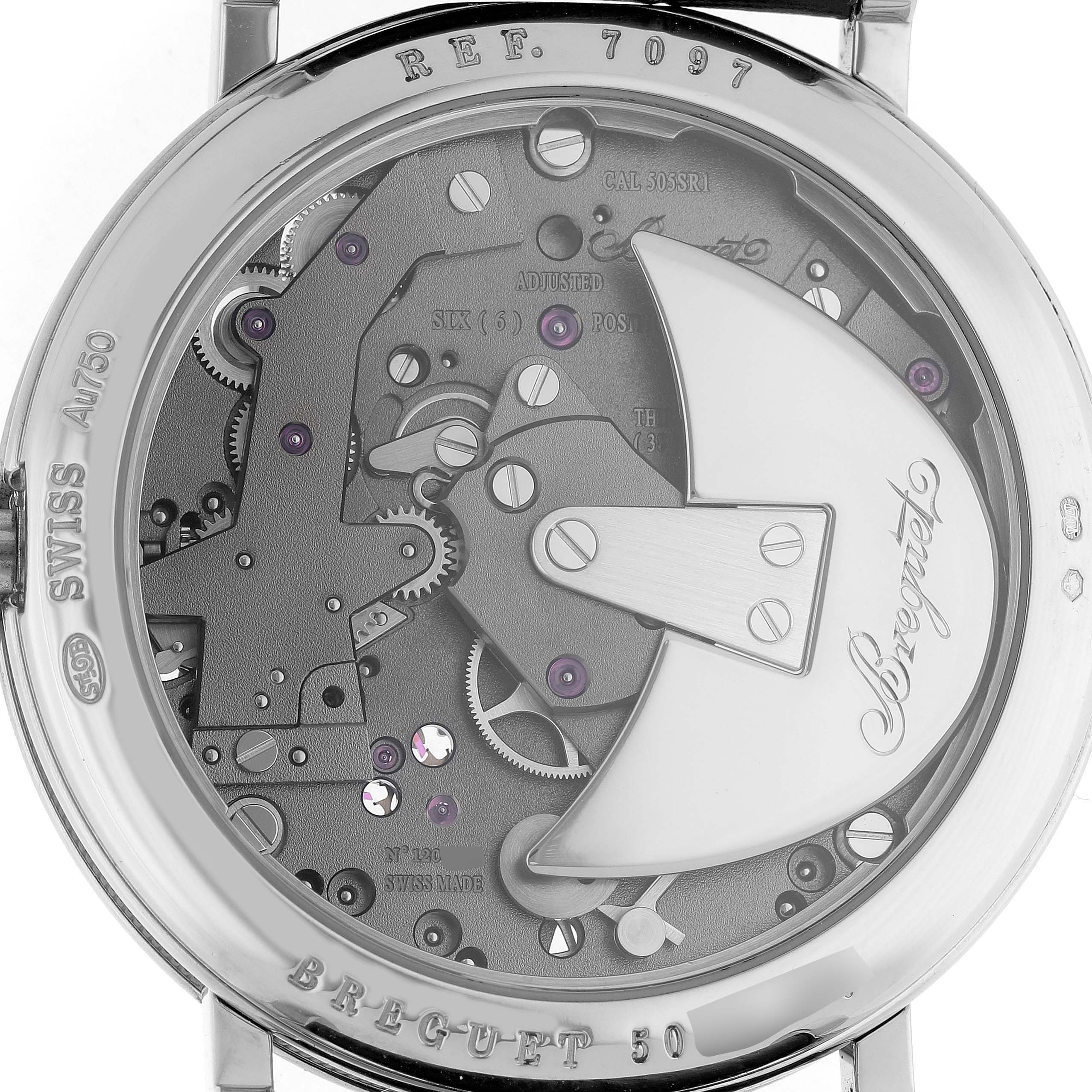 The image shows the back of a Breguet Tradition 7097 Men's White Gold Silver Dial model, highlighting its intricate movement and rotor.