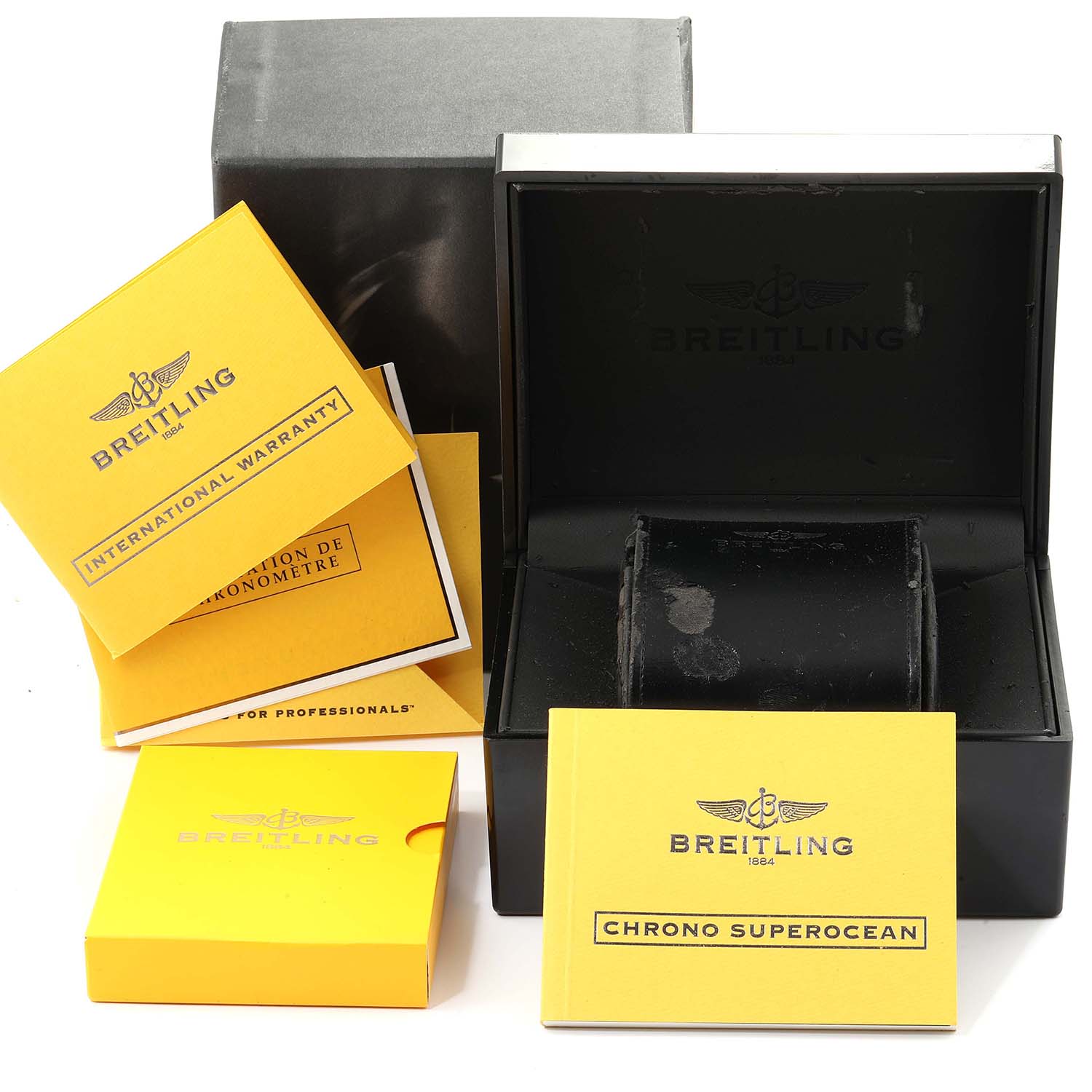 This image shows the box, international warranty, chronometer certification, and manuals for the Breitling A13340 Men's Stainless Steel Black Dial A13340 Men's Stainless Steel Black Dial Aeromarine Superocean A13340.