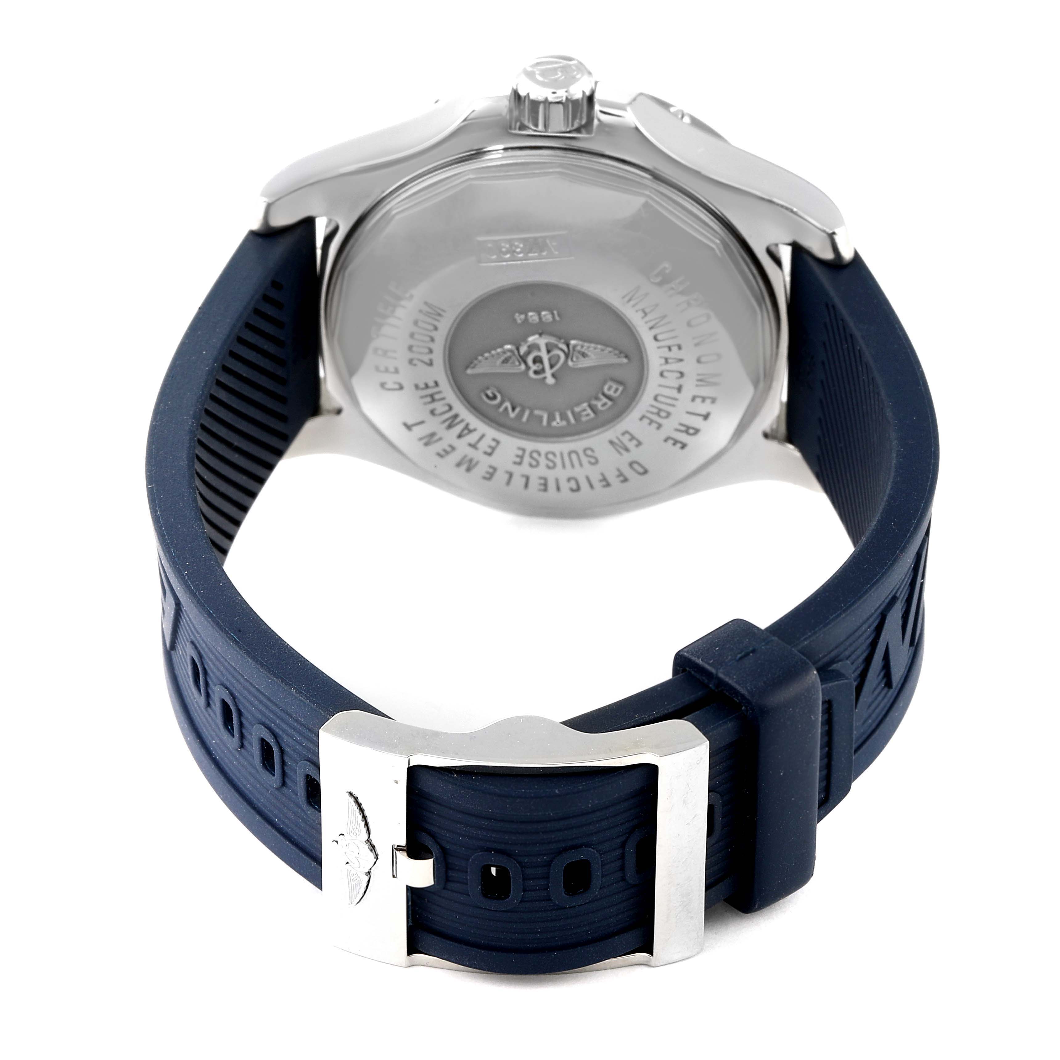 The image shows the back view of a Breitling Superocean A17390 Men's Stainless Steel Blue Dial A17390 Men's Stainless Steel Blue Dial watch, highlighting the case back, crown, and blue rubber strap with a metal buckle.