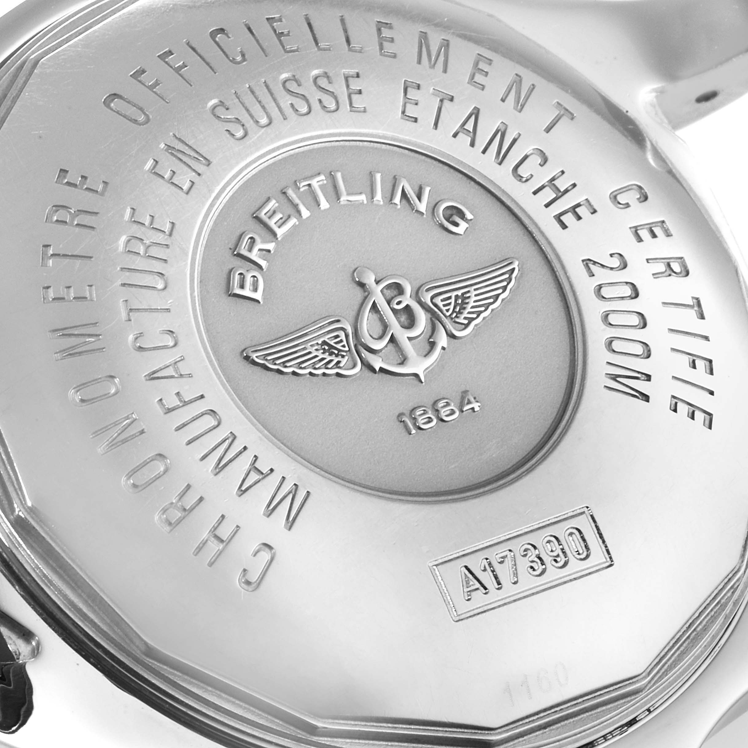 The image shows the back case of a Breitling Superocean A17390 Men's Stainless Steel Blue Dial A17390 Men's Stainless Steel Blue Dial watch with its engravings and logo.