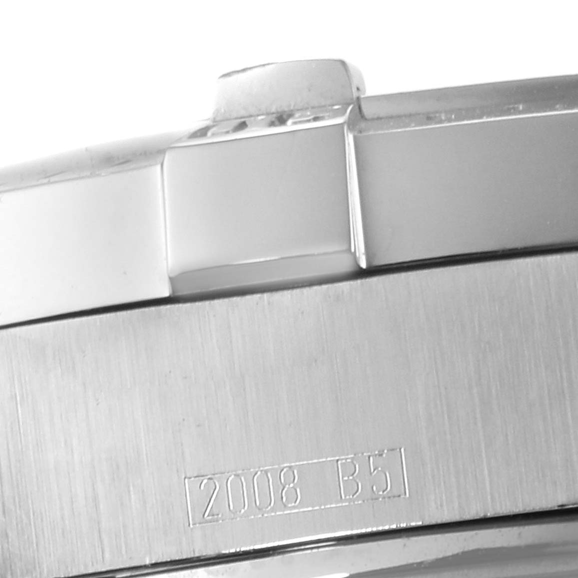 The image shows a close-up side view of the bezel and a portion of the case back of a Breitling Superocean A17390 Men's Stainless Steel Blue Dial A17390 Men's Stainless Steel Blue Dial watch with an engraving.