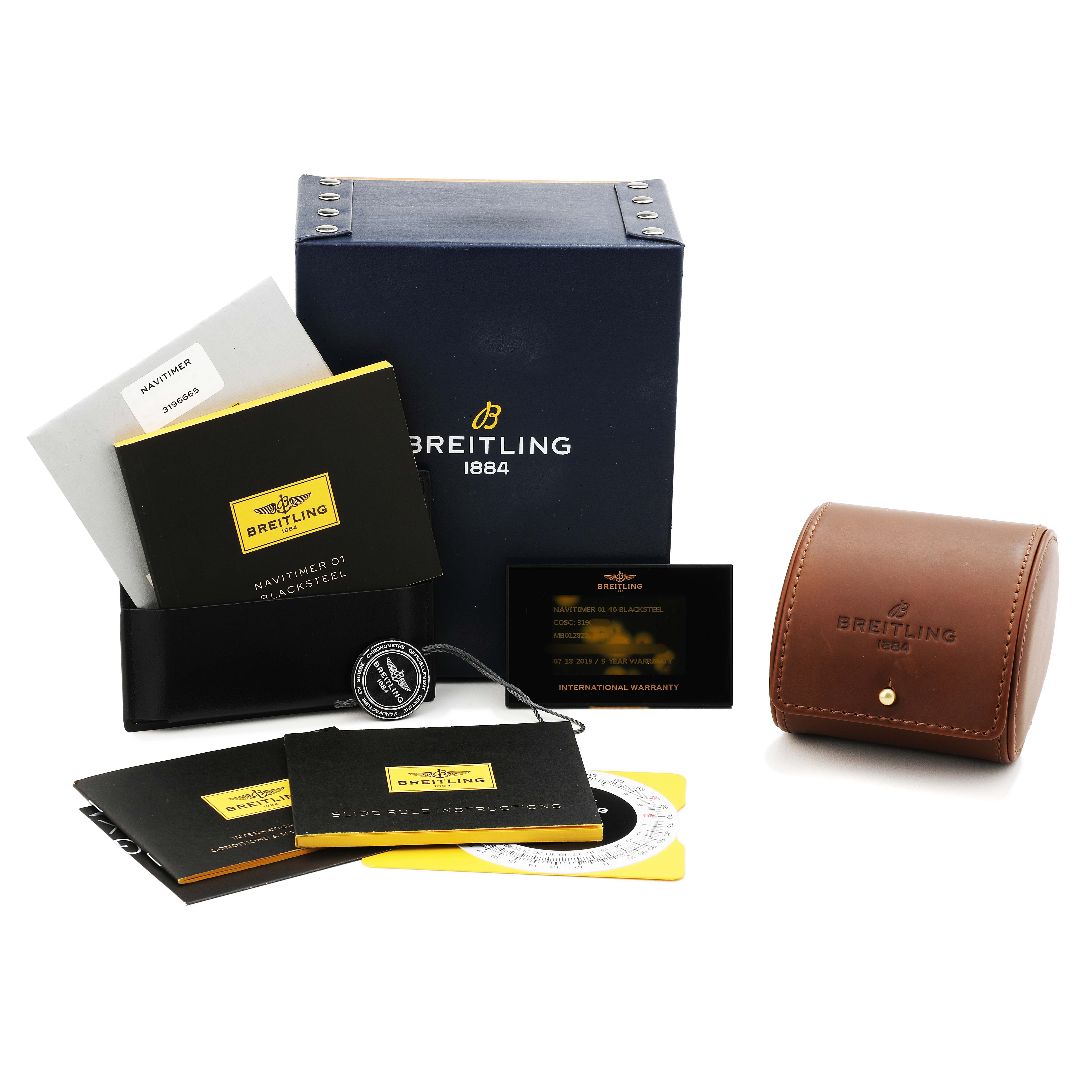 The image shows accessories for a Breitling Navitimer MB012822 / BE51 Men's Stainless Steel Black Dial, including a box, manuals, a leather case, and a warranty card.