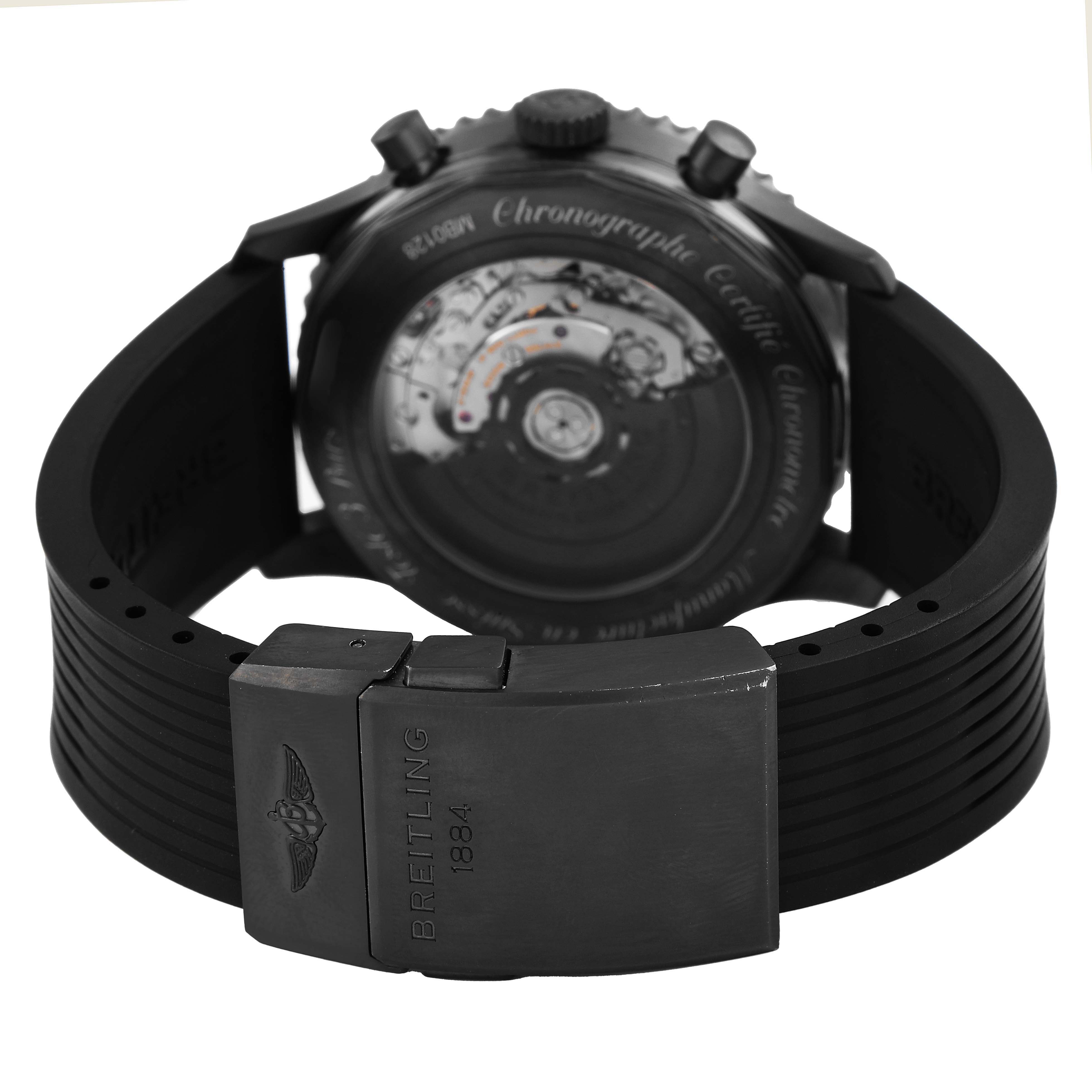 The image shows the back of a Breitling Navitimer MB012822 / BE51 Men's Stainless Steel Black Dial watch, revealing the movement and featuring the clasp and strap.